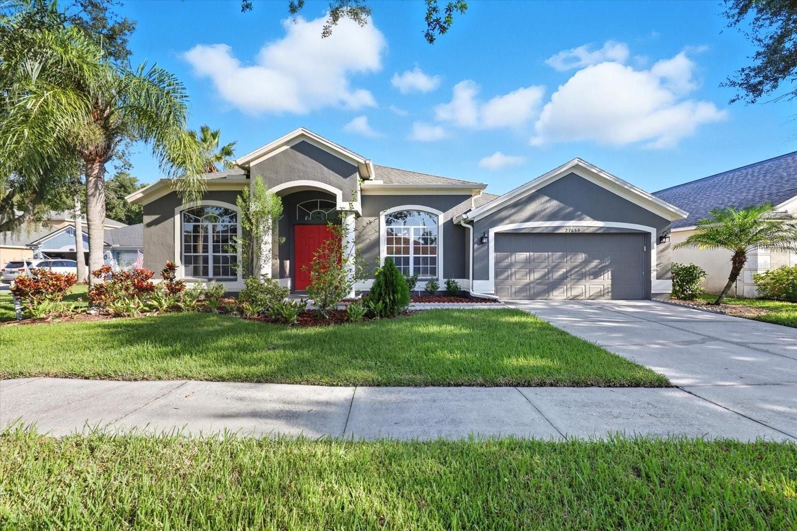 One or more photo(s) has been virtually staged. Welcome to this stunning 2-story home featuring 3,191 heated sq. ft. of living space, 4 bedrooms plus den/office, 4 full bathrooms, and a 2-car garage located in a quiet cul-de-sac with a serene pond view! From the inviting curb appeal with double door entry to the bright and spacious interior, this home is designed for both comfort and style! The open floor plan highlights formal dining room with tray ceilings and crown moldings, a gourmet kitchen with granite countertops, backsplash, exhaust vented hood, stainless steel appliances, a center island, and eat in area overlooking the spacious living room. The private owner’s suite includes walk-in closets, dual vanities, a garden tub, and a separate shower. Upstairs, the expansive bonus room provides versatile space for a media room or playroom. Enjoy Florida living in the covered enclosed lanai and fenced backyard with no rear neighbors—perfect for entertaining and relaxing. With fresh interior paint and exterior paint, and a prime location near Wiregrass Malls, Tampa Premium Outlet, LA Fitness, shopping, dining, and major highways, this home truly has it all! No CDD, low HOA! !