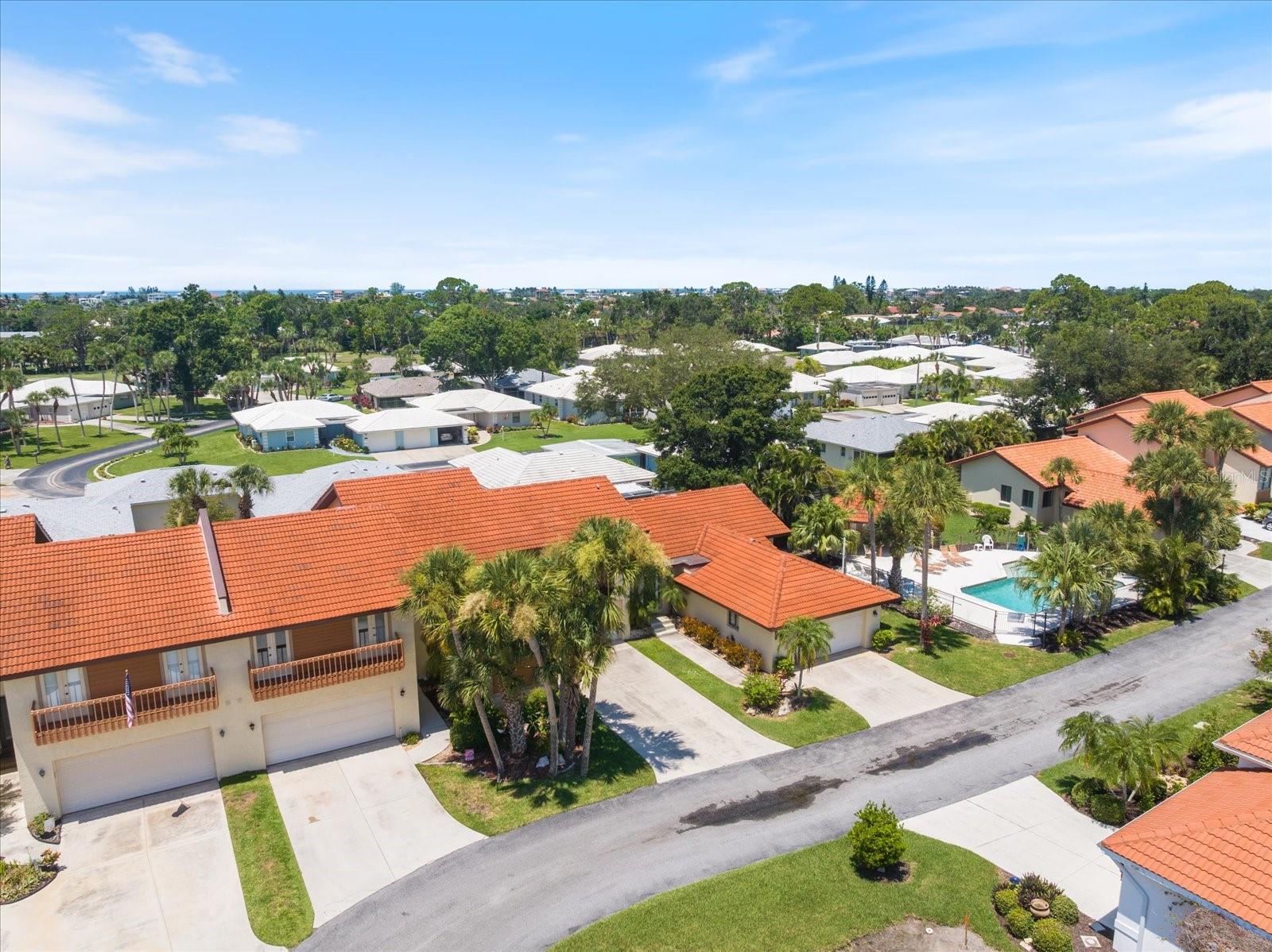 West of the Trail! Live minutes to the beach or use as a rental. This spacious condo has an open floor plan and very high ceilings with the primary bedroom on the first floor and 2 bedrooms on the 2nd floor. The master bedroom features a large master bath that includes a jetted tub, a walk-in shower, dual vanities, and a separate room for the commode. There are 3 sets of sliders providing access to the screened lanai—one in the master, one in the living room, and another in the dining area—perfect for enjoying morning coffee or an evening cocktail.
A half bath is conveniently located on the first floor for guests, while an upstairs full bath with a tub/shower serves the two bedrooms on the second floor. All bedrooms can accommodate a king-size bed, and one of the upstairs bedrooms features a walk-in closet and both have French doors leading to an outside balcony. The garage offers space for storing beach chairs, an ebike, and kayaks, keeping everything sheltered from the weather.
This home provides ample closet space, which is often a rare find in condos. The kitchen is phenomenal, showcasing recessed lighting, plenty of counter space, and cabinets with under-cabinet lighting. Stainless steel appliances, including a refrigerator and dishwasher, are relatively new at 3 years old. There’s also a pantry cabinet, and additional storage space is available under the stairs.
The dining room is graced with a lovely chandelier and is open to both the kitchen and living room, enhancing the spacious feel. The owner is leaving behind a washer and dryer that are about 5 years old. You'll be pleasantly surprised by the amount of space in this townhouse. It does need some touch-up TLC, mostly cleaning and paint. The same tile flows from the entry through the living room, dining room, and kitchen, while carpeting is present in the bedrooms, on the stairs, and upstairs.