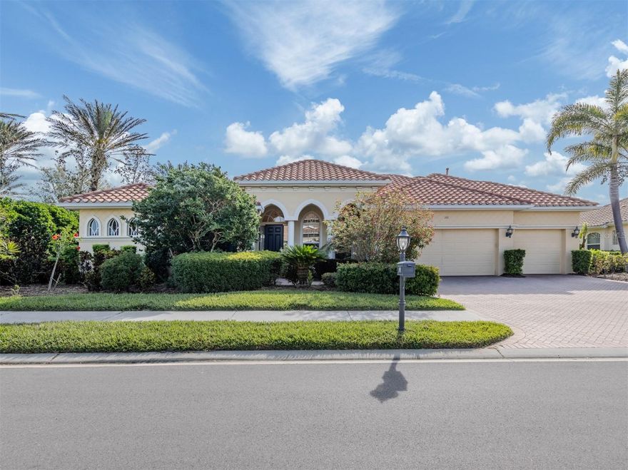 Leave the cares and stresses of the world behind as you step inside your personal sanctuary. Enter and let your eyes feast on the tropical haven that is your lanai. Wander past the living room and dining room to feel the warm embrace of the heart of the home.  Whether it be entertaining or family life, this house is ideal for you. The kitchen is large with newer appliances, large breakfast room with views of pool. Three bedrooms and two baths on one side of home accommodate family and guests. There is a first-floor study next to the large primary bedroom which is a peaceful retreat from the cares of the world. It contains a beautiful bath, walk-in closets, and an intimate sitting room for reading or contemplation.  Upstairs you will find an amazing room overlooking an equally amazing view. The room is decked out with built-in desk shelves, drawers, to be an incredible office for remote work, writing a best-selling novel, working out or converting to an artist studio, game room with pool table, or grandchildren's play room/bunk room. The lanai features a large pool with spa and high-top table for socializing, an outdoor shower and beautiful outdoor kitchen.  The whole area is a private oasis with mature trees for privacy and a long lake view. All this in the popular Venetian Golf & River Club where you can take advantage of amenities right out your door. Walk to the restaurant and enjoy Chef Bryan's yummy offerings which include special dinners, prime rib nights, pasta nights, burger nights, and pizza nights, and more. Walk to tennis, pickleball, lap pool, water aerobics, tiki bar, gym, free exercise classes, many games like bridge, mahjong, hand and foot.  You can even hop on to the exotic boardwalk through the jungle down to the Myakka River and the nature preserve from your backyard. It is all at your fingertips. Not to mention the proximity of this great subdivision to the highway, hospital, fire department, public beaches and the wonderful quaint town of Venice with its many restaurants, shops and theater. This is more than a house, it is a new way of life. The way life should be!