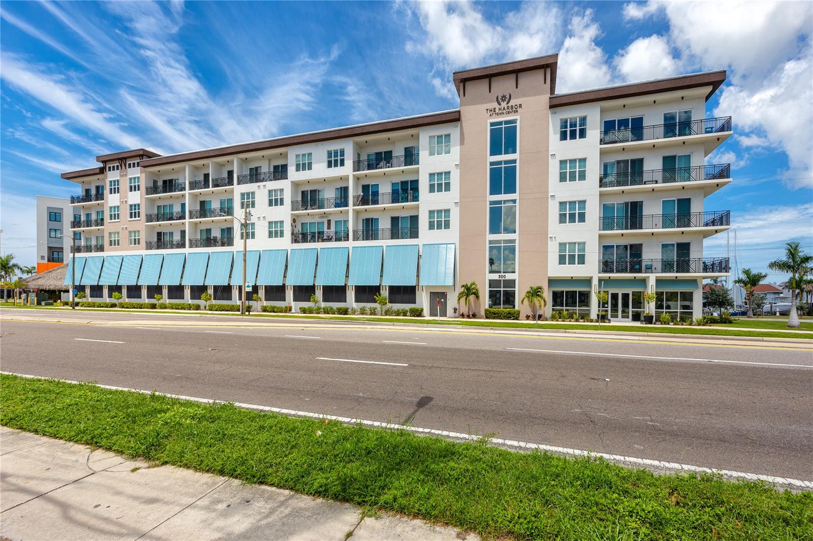 Welcome to The Harbor at Madeira Beach, where modern coastal elegance meets exceptional investment potential. Built in 2022, this immaculate 3-bedroom, 3-bath luxury condo with a private office offers the rare combination of high-end finishes, spacious design, and short-term rental eligibility—making it ideal for both full-time living and income-producing use.
Step inside and experience a bright, open layout with soaring ceilings, woodgrain luxury vinyl flooring, and designer pendant lighting. The chef’s kitchen is a true showpiece, featuring solid wood soft-close cabinetry, quartz countertops, a glass subway tile backsplash, premium stainless steel appliances, and a large center island with breakfast bar seating. Perfect for entertaining, the kitchen flows seamlessly into the dining and living areas, all opening onto a private balcony through hurricane-rated sliders with sweeping sunset views over Madeira Beach.
The primary suite is a serene retreat, highlighted by an oversized walk-in closet with custom California-style built-ins, private balcony access, and a spa-inspired ensuite bath with dual vanities, quartz countertops, built-in shelving, a soaking tub, and a separate glass-enclosed shower. A split floor plan provides privacy, with two additional spacious bedrooms—each with custom closets and French door entry—plus two additional full baths. A dedicated office with French doors offers the flexibility of a work-from-home space or guest room.
Designed for convenience, this condo includes an in-unit laundry with built-in cabinetry, two assigned under-building parking spaces, and private storage for beach essentials. Resort-style amenities enhance the lifestyle, including a heated pool and spa overlooking the harbor, a state-of-the-art fitness center, and secure key-fob access to the lobby and gated garage.
Perfectly situated in Madeira Beach Town Center, residents are just steps from the waterfront recreation park, City Hall, library, and post office, and minutes from the world-famous John’s Pass Village & Boardwalk. With direct access to shopping, dining, and entertainment—and all the Gulf Coast beaches nearby—this location offers unmatched convenience and appeal.
As one of the few luxury buildings in Madeira Beach allowing short-term rentals, The Harbor presents a rare opportunity to own a beautifully maintained, income-generating coastal property. Whether you’re seeking a personal retreat, a part-time residence, or a high-demand STR investment, this condo delivers on every level.
Schedule your private showing today and discover why Madeira Beach continues to be one of Pinellas County’s most desirable destinations for both living and investing.