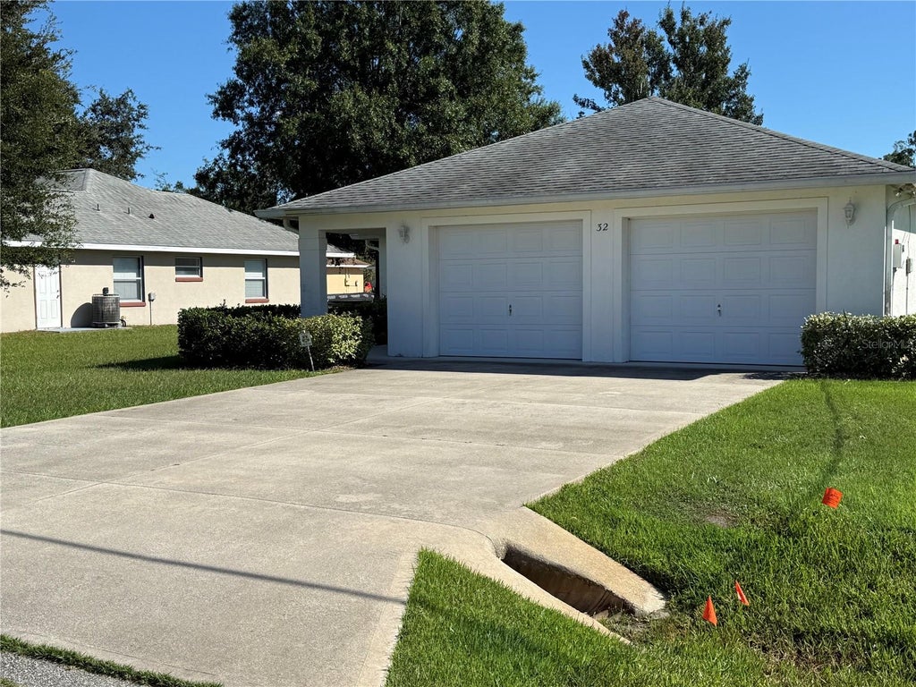 Photo of 32 Raeland Lane, Palm Coast, FL 32164 (MLS # FC321719)