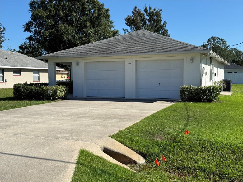 Photo of 32 Raeland Lane, Palm Coast, FL 32164 (MLS # FC321719)