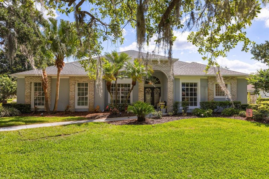Located in one of the most sought-after communities in St. Cloud, welcome to Hammock Pointe.  Known for its beautiful tree-lined streets, spacious homesites, and custom character throughout the neighborhood. Situated on a corner lot just under 1/2 acre, this 3-bedroom, 2-bath home offers space, privacy, and endless potential.
Step inside to an open-concept layout with plantation shutters thoughout. A large formal dining room to the left and the third bedroom to the right of the entryway. The spacious living room flows seamlessly out to the oversized screened-in patio, partially covered by roofline and then covered by high screens.  Perfect for entertaining or relaxing while enjoying the peaceful surroundings.
The bright and airy kitchen offers an abundance of cabinet space with a sink that overlooks the large dinette area and has beautiful views of the patio.  The primary suite feels like its own oasis.  Featuring a unique U-shaped closet, private patio access, and a spacious bathroom with a soaking tub and separate shower. The second bedroom is located on the other side of home and is essentially an additional primary suite with a large walk-in closet, its own attached bathroom, soaking tub, dual vanities, and separate shower.
Additional highlights include an oversized side-entry 2-car garage WITH A/C! Perfect for a Florida summer! Plus, there is plenty of storage in the garage with multiple closets.  A water softener system is included with the sale, as well as the washer and dryer. Don’t miss your opportunity to own in one of St. Cloud’s hidden gems.