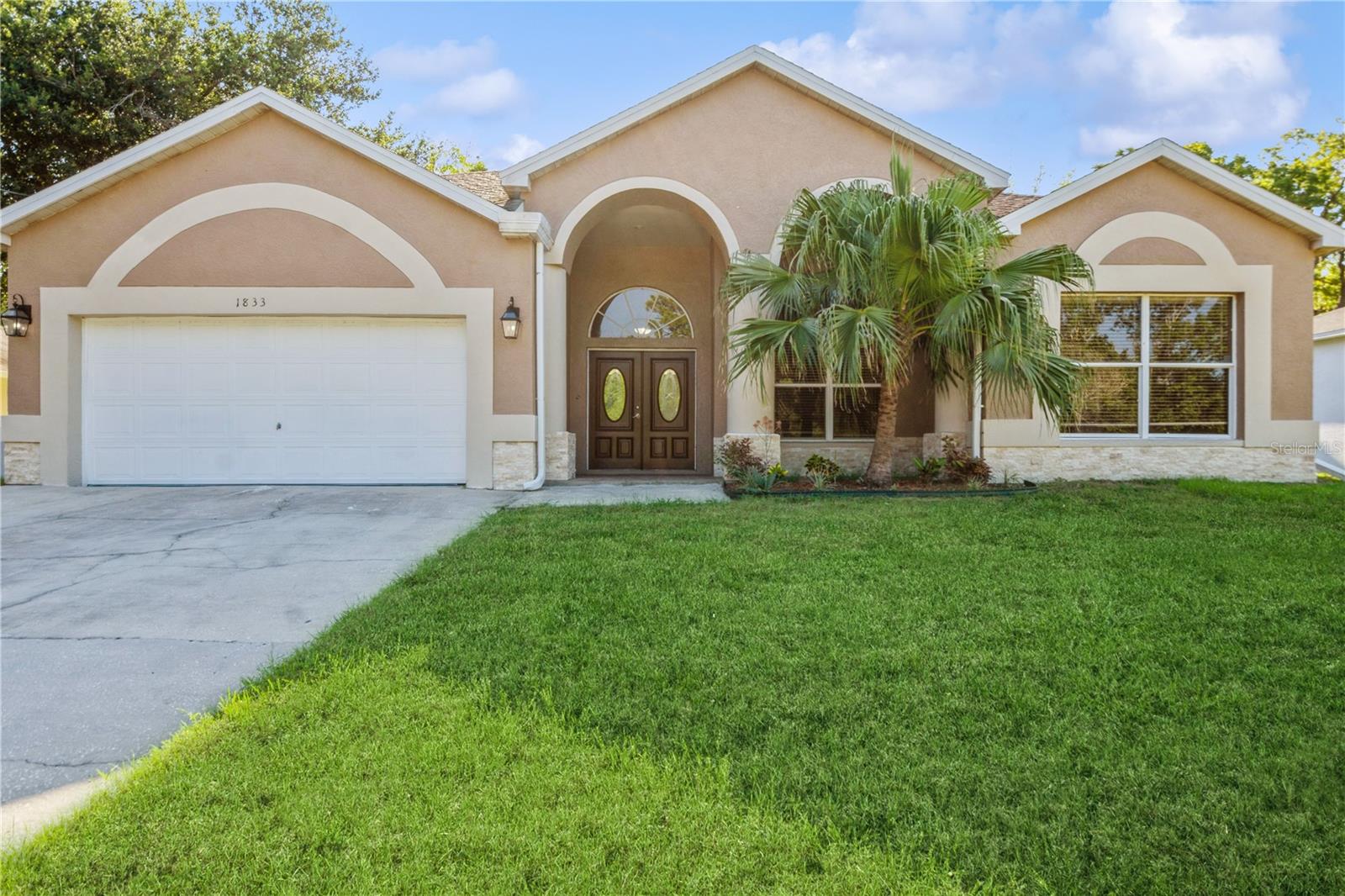 Welcome to your dream home located in Tarpon Springs! This stunning 3-bedroom, 2.5-bathroom home is nestled just outside of the highly sought after Grassy Point community. Boasting over 2100 square feet, this property offers ample space for entertainment and everyday living. As you enter the home, you are greeted by soaring high ceilings and natural light flooding throughout the entire home, providing a bright and welcoming atmosphere.
Showcasing a delightful combination of coziness and practicality, this exceptional property features beautiful laminate flooring throughout the kitchen and living room, enhancing its natural radiance. The free-flowing living and dining area provides the perfect space for hosting gatherings or unwinding after a long day.
As you enter the kitchen, prepare to be enchanted by the modern updates, featuring solid wood cabinets, exquisite granite countertops, and sleek stainless steel appliances that will inspire your inner chef. This open-concept floorplan effortlessly connects the gorgeous kitchen to the warm and welcoming living room, fostering a seamless and inclusive environment perfect for hosting gatherings with friends and family.
The thoughtfully designed floorplan offers a secluded primary bedroom, enhancing a sense of privacy and comfort. It is a true retreat, complete with plenty of closet space and a luxurious en-suite bathroom equipped with a garden tub and walk-in shower.
This property is conveniently located near gulf beaches, Downtown Tarpon Springs, quality restaurants, the world-renowned Sponge Docks of Tarpon Springs, and so much more. Whether you’re relaxing indoors or exploring the community, this remarkable property offers the ideal balance of style, convenience, and fun. Don’t miss the opportunity to make it yours and schedule a showing today to experience all that this home and lifestyle has to offer!