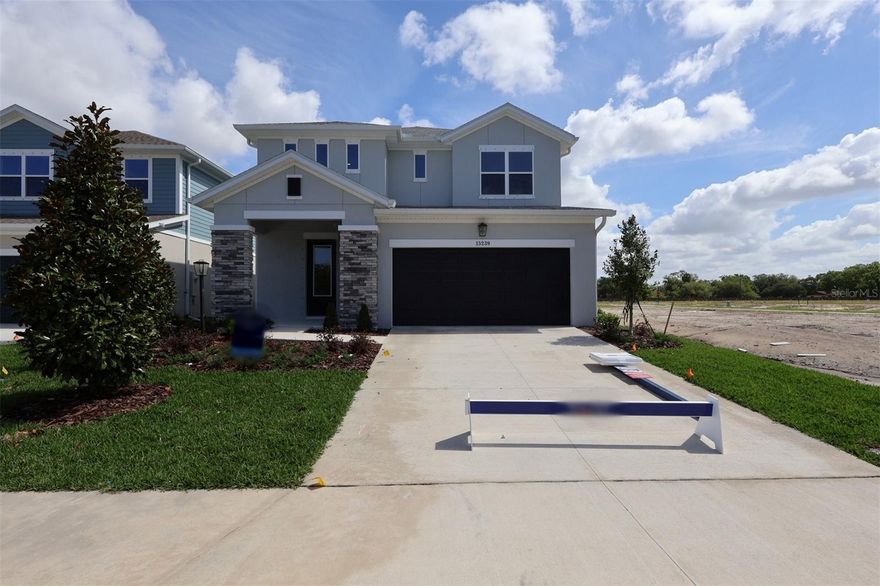 Under Construction. Discover the Zander by David Weekley Homes at Eastlyn in Bradenton, FL,  Just ten minutes from I-75 and SR 64 you'll find a two-story home beautifully designed for you,  where modern elegance meets everyday functionality. With no CDD Fees and low-HOA, Eastlyn provides a peaceful setting that's close enough to the highway to be convenient, yet far enough away to avoid the big city traffic. Only a 4-minute drive from groceries, 10 minutes to the Costco/Target shopping center where you'll find a variety of stores and top restaurants. Easy access to Sarasota, St. Petersburg, and Tampa allow you to enjoy big city amenities when you want them and the serene relaxation when you don't. 

This spacious floor plan offers 4 bedrooms, 3.5 bathrooms, 2 car garage and a large upstairs retreat that can serve as a game room, home theater, or quiet reading nook and is backed by David Weekley Homes' comprehensive 1-2-10 warranty. 

The upgraded gourmet kitchen is a showstopper, featuring quartz countertops, a large walk-in pantry, and seamless flow into the open-concept dining and family areas. Outstanding use of windows and natural light in the atrium style main living area enhances the luxury throughout and adds an elegant feel. The Owner’s Retreat provides a private escape with a spa-inspired Super Shower, and a spacious walk-in closet. The flooring choices throughout are sure to please with durable laminate flooring running through the main living spaces, blending style with practicality and tile in the bathrooms and carpet in the bedrooms. An extended covered lanai with 12' sliders extends the living space outdoors, perfect for morning coffee or evening conversations under the Florida sky.