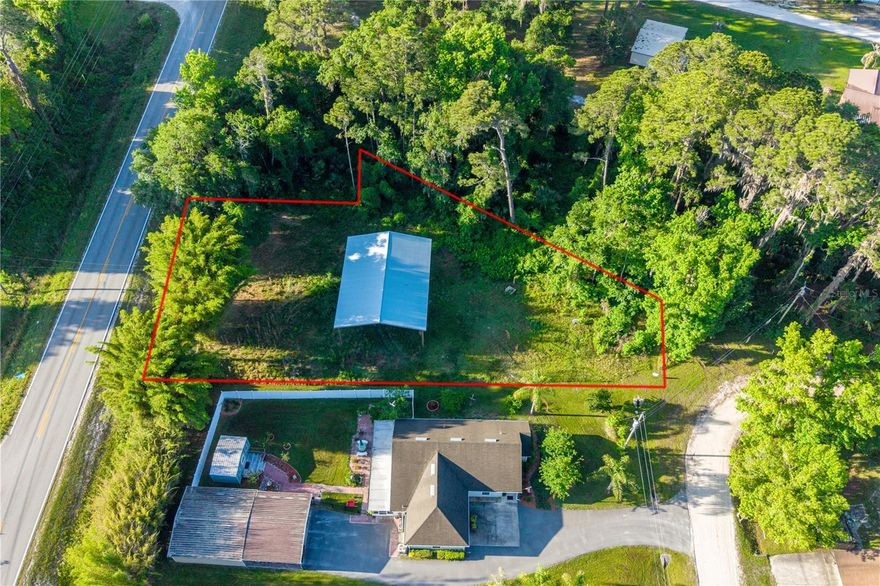 Looking for a lot near the water? This peaceful 0.38 acre double lot in River Park, offers lots of possibilities to create your own private retreat tailored to your lifestyle. Come build your home or convert the new (2025) 48x36 pole barn into a unique Barndominium. City Water & Sewer hookups/taps are already at the property. River Park Community offers its homeowners a private boat ramp and for a small yearly fee a covered boat slip. Enjoy the convenience of easy access to the St. Johns River, perfect for boating, fishing and soaking up Florida’s outdoors. Whether you’re looking to build, invest, or escape, this property is full of opportunity, peace and tranquility. River Park allows RV parking and has no rental restrictions. (2024) survey available, seller also has house plans & site plan that he will give to the new buyer. For more info or a private tour give me a call.
