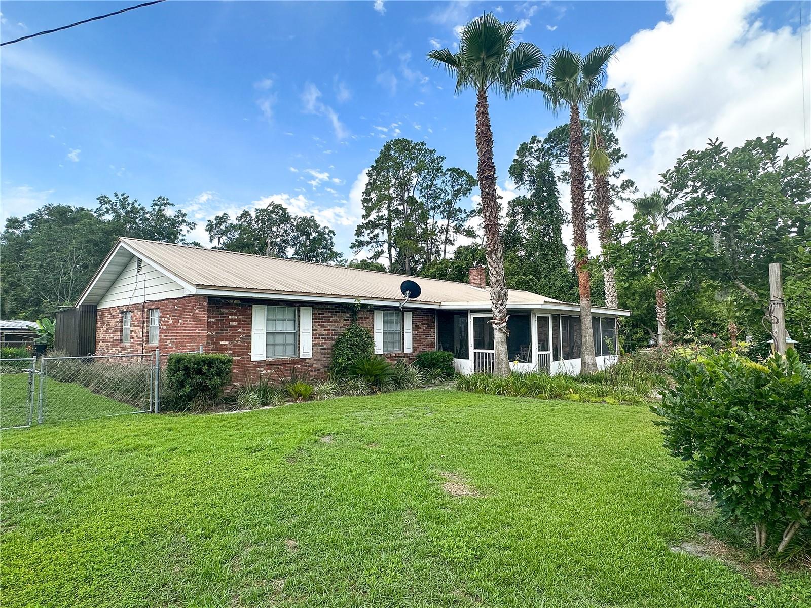 Under contract-accepting backup offers. Charming ranch home in the quaint historic town of Mayo. Walk to main street and enjoy local shops and restaurants. The home features a screened in front porch, a main living room with a wood burning fireplace, an attached garage, a dining room, three generous sized bedrooms, a hall bath with a Step Safe tub, and the master bath with a walk-in shower. There is an additional kitchen and family room which could be used as a mother-in-law suite or additional space for entertaining guests. The home was professionally underpinned on the front left corner of the home due to soil movement. Owner will need 10-15 after closing to post occupy the home. Home sold AS-IS
