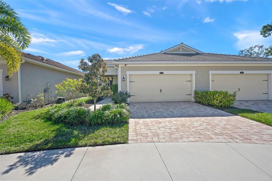 First time on the market! This newer-built, resilient home was constructed in 2019 to the latest hurricane codes and no flood insurance is required. Featuring a highly sought-after 2BR+Office/2BA floor plan with a 2-car garage, this residence is one of only 10 Maritime models built by Mattamy Homes, making it a rare opportunity.
A welcoming front porch with retractable screen door provides wonderful airflow and leads to a gorgeous impact-glass front door. Inside, the open-concept layout is ideal for both everyday living and entertaining. The beautifully appointed kitchen showcases wood cabinetry, glass tile backsplash, quartz countertops, stainless steel appliances, and dimmable pendant lighting. The adjacent dining area comfortably accommodates a variety of table sizes and flows seamlessly into the spacious great room—perfect for gatherings.
The primary suite offers a tray ceiling and a luxurious en-suite bath featuring an oversized frameless glass shower with bench seating, dual vanities, and a large walk-in closet. The guest suite is privately tucked away with an adjoining bath, providing excellent separation and privacy. The study includes a built-in desk and French doors, making it ideal for a home office or den.
Additional highlights include tile flooring throughout the main living areas and study, 2 carpeted bedrooms, a laundry room with extra storage, and a finished garage with epoxy floors, utility sink, and an additional refrigerator.  Crown molding and framed windows/sliders  add an elegant, refined finish.  Enjoy Florida living from the covered front porch or relax on the covered, rear screened lanai with pavers and privacy screen overlooking peaceful water and park-like views. Situated at the end of a cul-de-sac, this home benefits from minimal drive-by traffic.  For added peace of mind, there are Accordion Shutters for all windows and sliders making preparing for hurricane a simple task that only takes minutes.
The monthly HOA fee covers roof repair and replacement, exterior painting, exterior insurance, grounds maintenance, irrigation, and access to all community amenities and events. Sunrise Preserve at Palmer Ranch is a gated community offering resort-style amenities including a pool, tennis, pickleball and bocce ball courts, grilling areas, fire pit, clubhouse, and fully equipped fitness center. A robust calendar of social events makes it easy to meet neighbors and stay active.
Ideally located in the Palmer Ranch area —convenient to shopping, dining, I-75, and world-class beaches.