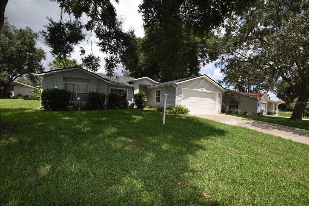 Photo of 5137 Desoto Way, Leesburg, FL 34748 (MLS # O6435619)