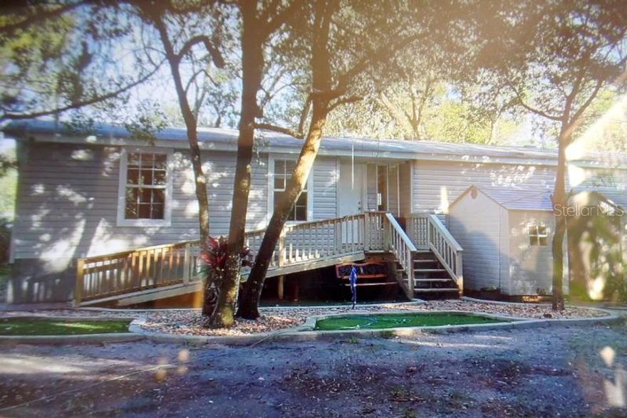 CUSTOM BUILT HIGH QUALITY JACOBSEN MANUFACTURED HOME. 2046 SQ FT OF LUXURY LIVING SPACE. HUGE KITCHEN HAS SS APPL., TONS OF BEAUTIFUL WOOD CABINETS, HUGE LAUNDRY ROOM WITH MORE CABINETS, WOOD LOOK VINYL FlOORS THROUGH OUT MAIN AREAS. MASTER BDRM HAS 2 LRGE WALK IN CLOSETS AND DOUBLE VANITIES, WALK IN SHOWER AND GARDEN TUB. THE GREAT ROOM BOASTS A BEAUTIFUL HAND LAID STONE FIREPLACE. THE HOME HAS THERMAL PANE WINDOWS, R30 INSULATED ROOF, AND IS LOCATED IN A CONVENIENT PORT ORANGE NEIGHBORHOOD WITH NO HOA. CURRENT HOME INSPECTION AND CERTIFIED APPRAISAL AVAILABLE ;Water: City