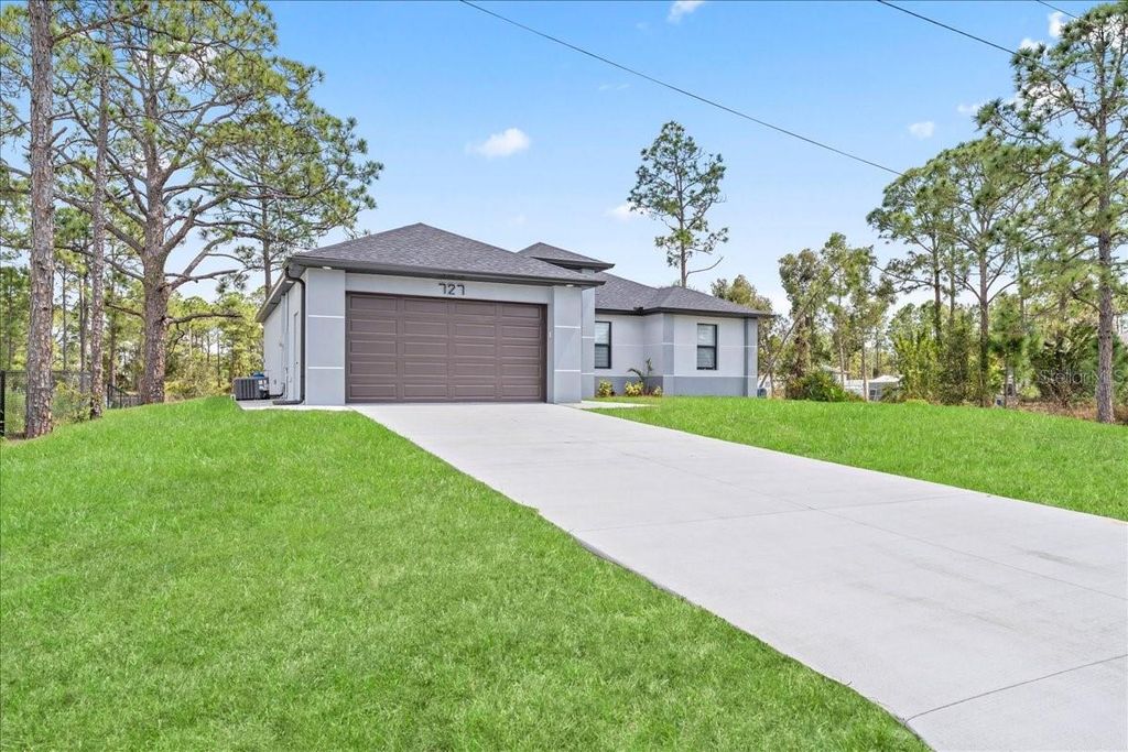 Photo of 727 Drury Avenue, Lehigh Acres, FL 33974 (MLS # A4685774)