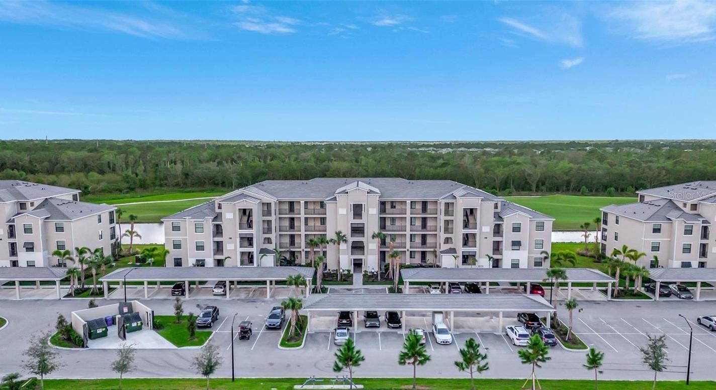 **THIS PRICE IS REAL - Seller wants it SOLD. Their loss is your gain!!** Florida Resort Style living at its best! This gorgeous **FULLY FURNISHED PENTHOUSE END UNIT ** is a must see. Million-dollar views at an affordable price – Enjoy privacy overlooking golf, water and preserve views over the 14th and 15th holes of the Piper Course at Lakewood National Golf Club (a host of the PGA LECOM Suncoast Classic). GOLF IS INCLUDED! Don't miss out on an opportunity to purchase an immaculate, professionally FURNISHED and decorated fourth floor unit. This popular Birkdale floorplan has 2 Beds/2 Baths and features an open eat-in kitchen with a huge counter height island, stainless steel appliances, Quartz tops and white shaker style wood cabinets. There is 20" floor tile in all main living areas with LVP flooring in the bedrooms. The adjoining Kitchen, Living and Dining Rooms are ideal for entertaining. Indoor utility closet with washer and dryer included. Outdoor storage unit comes with condo as well. In addition to your golf membership, at Lakewood National you can enjoy the resort style community pool, poolside cafe/tiki bar, tennis courts, pickleball courts, fitness center, full-service spa, and Grand Clubhouse offering elegant dining. Gated with 24-hour security, this community truly has it all! This condo is ready to move right in. Perfect primary, seasonal or investment property – this one check all the boxes.