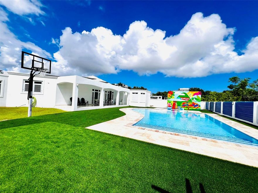 Excellent investment opportunity for short-term rentals (Established Airbnb and other rental platforms). The property has been on the market for more than 8 years with annual current income of $150,000 on average (Currently with incomes of up to $175,000/year with evidence) Recover your investment in 5 years. Only 25 minutes away from SJU AIRPORT, 15 minutes away from el Yunque Rain Forest, 10 minutes away from Luquillo beaches and lots of adventures locations for locals and tourists to have fun and enjoy the beauty of the island of PR like Vieques and Culebra Island, El Yunque Rain Forest, Bioluminescence Bays, Old San Juan, Isla Verde, Fajardo for best charters and beaches like Icacos and Palominos Islands and much more. Whether for business, mixed or own use, it is a dream land property. The property accommodates up to 20 guests in bed and activities for up to 60 guests, includes all the furniture and furnishings you see in the photos, property has solar panels with fixed payment of $668 monthly for electricity, also includes 40kw generator, pool with heater, 4 large bedrooms, 2 full bathrooms and two half bathrooms, two dining rooms, giant kitchen, living room, billiards and games area, laundry, covered garage for cars, additional parking in front of the property for up to 20 cars, small neighborhood of only 20 houses with lots of privacy, spectacular views of green areas including the mountains Of El Yunque. Sale not by appraisal, value is evaluated by income in an investment property. For any doubts or questions or additional photos you can contact me. Financing available. All serious and reasonable offers will be considered. CALL THE CALL CENTER FOR APPOINTMENTS.