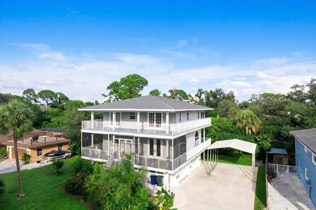 Photo of 1775 Scenic Drive, Venice, FL 34293 (MLS # N6146147)