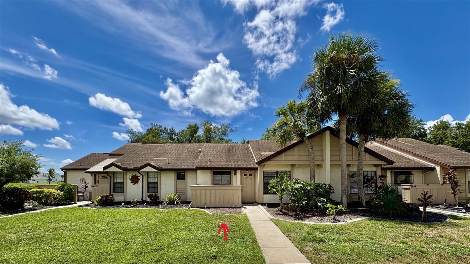 Welcome to Your Slice of Florida Paradise in Fairway Villas! Tucked away in one of North Port’s most desirable communities, this beautifully maintained 2-bedroom, 1.5-bath villa offers the perfect combination of comfort, convenience, and relaxed Florida living. Whether you're looking for a full-time residence or seasonal escape, this charming home has everything you need and more. Step inside and you’ll instantly feel at home. The spacious open floor plan invites easy living and effortless entertaining, while the soaring cathedral ceilings with exposed beams add a sense of character and warmth. The living and dining areas are filled with natural light and feature durable tile flooring, making them as practical as they are stylish. Both bedrooms are comfortably carpeted, providing a cozy retreat at the end of the day. The split-bedroom design offers added privacy, making it ideal for hosting guests or creating a quiet office or hobby space. The primary suite boasts a beautifully updated en-suite bathroom with a sleek walk-in shower, while the half bath also features a modern vanity and connects directly to a convenient laundry area with a full-size washer and dryer. Step through the sliding glass doors and find yourself in what just might become your favorite space—the expansive screened-in lanai. Whether you're enjoying a peaceful morning coffee, curling up with a good book in the afternoon breeze, or sipping cocktails with friends as the sun sets, this private outdoor space is the perfect extension of your home. Practical updates like city water/sewer and a newer roof (installed in 2014) provides peace of mind, while the well-maintained, quiet neighborhood adds to the sense of security and ease. Fairway Villas is known for its friendly atmosphere and pride of ownership. When it comes to location, it truly doesn’t get better than this. You’re just minutes from US-41 and I-75, placing you within easy reach of shopping and dining at Cocoplum Village, medical centers, golf courses, Warm Mineral Springs, North Port Aquatic Center, and Wellen Park—home to the Atlanta Braves Spring Training Complex and when you’re ready to explore the coast, you’re just a short drive away from the pristine Gulf beaches, scenic parks, and the charming shops and restaurants of historic downtown Venice. If you've been searching for a move-in-ready villa in a peaceful, friendly community close to everything—this is the one! Don’t wait—schedule your private showing today and see for yourself why life in Fairway Villas is exactly what you’ve been dreaming of!
