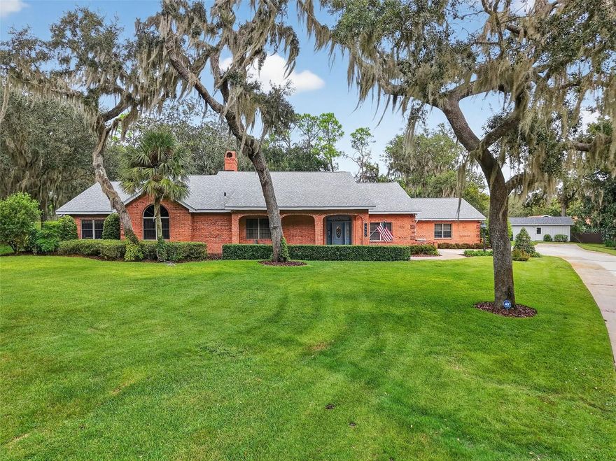 Discover this exceptional custom brick home where attention to detail meets practical luxury.  This meticulously crafted residence showcases beautiful brick   corbel detailing and landscaping that creates an impressive first impression.  The roof was replaced in 2024, ensuring peace of mind for years to come.  The heart of the home features a spacious kitchen designed for both everyday cooking and entertaining.  An island provides additional prep space while the built-in cabinetry and a large walk-in pantry offer abundant storage solutions.  Custom Wood-Mode oak cabinets throughout the home add warmth to every room with clever storage solutions tucked around almost every corner.  Relax in the inviting living room, where a cozy gas fireplace creates the perfect ambiance beneath soaring vaulted ceilings adorned with beautiful wood beams.  The expansive Florida room features a cedar tongue and groove ceiling that creates a warm and inviting atmosphere.  This versatile space connects seamlessly to the kitchen, living room and the primary bedroom, making it perfect for relaxing or hosting gatherings.  A versatile office with beautiful wood flooring and built-in desk provides the perfect workspace and could easily serve as a fourth bedroom.  Double pane wood sash windows throughout ensure energy efficiency while maintaining classic charm.  Practical amenities abound with a whole house propane generator professionally serviced twice yearly with a 500-gallon propane tank to ensure uninterrupted comfort during power outages.  The central vacuum system adds convenience to daily maintenance.  For wood workers or mechanics, the heated and cooled attached workshop with a half bath that is plumbed for a future shower is a true bonus.  Outside you will find multiple additional storage solutions, with a pump house and a tractor shed, both having electricity, lighting, walk through and roll up doors.  Whether you’re drawn to the custom craftsmanship or extensive storage solutions, this home delivers exceptional value for discerning buyers who appreciate quality construction and thoughtful design details.  All room sizes are approximate and should be verified.