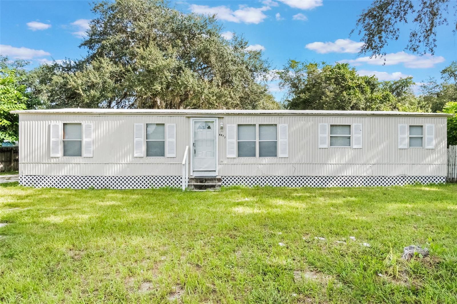 **New Listing in St Cloud, FL - Ready for Your Appraisal**
Discover this well-positioned 4-bedroom, 2-bathroom home at 4977 Countryside Ct in St Cloud, Florida. This 1,512 square foot house sits in a convenient location with easy access to shopping, restaurants, theme parks, major roads, and the airport.
The property features an open floor plan with high ceilings that create a spacious feel throughout. Hard flooring runs through the entire home, making maintenance simple and giving it a clean, modern look. The kitchen comes equipped with stainless steel appliances that are ready for your family's daily needs.
Recent updates include a new air conditioning system installed just 6 months ago, ensuring year-round comfort. The home is completely move-in ready, so you can settle in without delay.
One of the standout features is the backyard that backs up to a peaceful pond, offering a serene view and natural privacy. The property also provides plenty of parking space for RVs, boats, work equipment, and multiple vehicles - perfect for families with various recreational or work needs.
St Cloud's location puts you close to all the attractions Central Florida has to offer while maintaining a residential community feel. Whether you're commuting to work, heading to the theme parks, or enjoying local dining and shopping, everything is conveniently accessible.
This home combines practical features with a desirable location, making it an excellent choice for families looking for comfort and convenience in the St Cloud area.