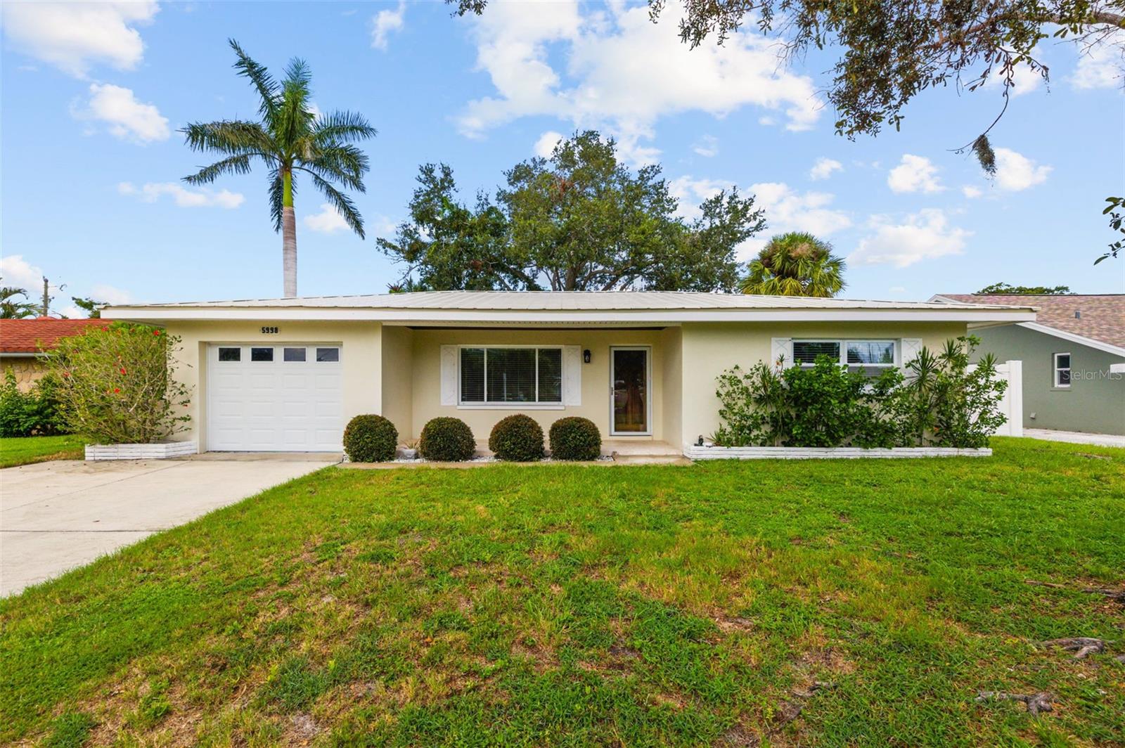 Turn-Key 2BR Home in Seminole – High & Dry, No Flood Insurance Required! Move right in and enjoy Florida living in this beautifully updated 2 bedroom, 1 bathroom block home located in a non-flood zone (X-Zone). With every major upgrade already done, this home is truly turn-key! The interior boasts a brand-new kitchen with all-wood cabinetry, quartz counters, and newer stainless appliances, plus a fully remodeled bathroom and real hardwood floors throughout. The newer windows, updated electrical panel with new wiring, newer ac system, and lifetime metal roof provide lasting peace of mind.
Got toys, love to entertain, or have pets?! This home has it all! The home includes an oversized 1-car garage with plenty of off-street parking. A covered back porch that is perfect for entertaining, or simply relaxing in your private space, and includes a fully fenced in yard, perfect for pets.
Lets talk about a prime location! Located less than 8 minutes to the Gulf Beaches, 5 minutes to Seminole City Center shopping and dining, and only 35 minutes to Tampa International Airport. High and dry, beautifully upgraded, and close to everything — this Seminole home is ready for its new owner. Nothing left to do but bring your toothbrush!