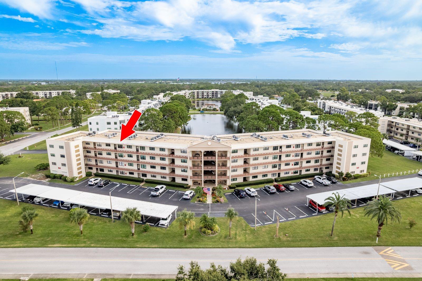 Imagine waking up every day to the serene peaceful view of mature landscaping and a lovely pond. Welcome home to the serenity of Terrace Park of Five Towns and the Jefferson building! This friendly 55+ pet friendly community is just a short drive from the beautiful gulf beaches, shopping and dining. Only 20-25 minutes to both St Peterburg Airport and Tampa International making this location very accessible. This is a wonderful top floor spacious unit with 1,135sq ft of living space. A fabulous screened in lanai overlooks a beautiful pond with plenty of trees for shade (also has enclosure windows to make this space more year round). This home boasts of two well sized bedrooms, an open concept kitchen with eat in breakfast nook. The living room and dining area complete this lovely space. Full size washer and dryer for your convenience inside the home. Small storage space in the common area is included as well as common laundry is available if preferred. The primary bedroom has a full shower while the second bathroom has a full tub. This unit includes a covered carport space (63). The condo fee includes gas, cable, internet, water, sewer, insurance for building and trash removal. You can relax on your private lanai or become involved with one of the many community features including but not limited to: walking trails, six pools and a spa, library, meeting rooms, card and game room, billiard room, workout room, theatre and more. For the sports enthusiasts you will not miss a beat with the bocce ball, horseshoes, pickle ball, shuffleboard, yoga, tennis and so many other free clubs to join onsite. The pools are heated, and the Magnolia saltwater pool is located across from the Jefferson building along with a clubhouse. The Oleander clubhouse is also located nearby with similar amenities and movie Friday in the theater. With an active social calendar you may never leave, however when you do need to venture out shopping, dining, and medical facilities are right around the corner. Peace of mind goes a long way so if you are a snowbird, investor, second homeowner or year-round resident Five Towns will provide you with a comfortable lifestyle.