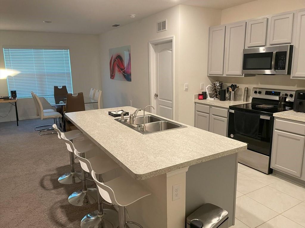 Photo of 1806 Silverbell Loop, Haines City, FL 33844 (MLS # TB8435155)