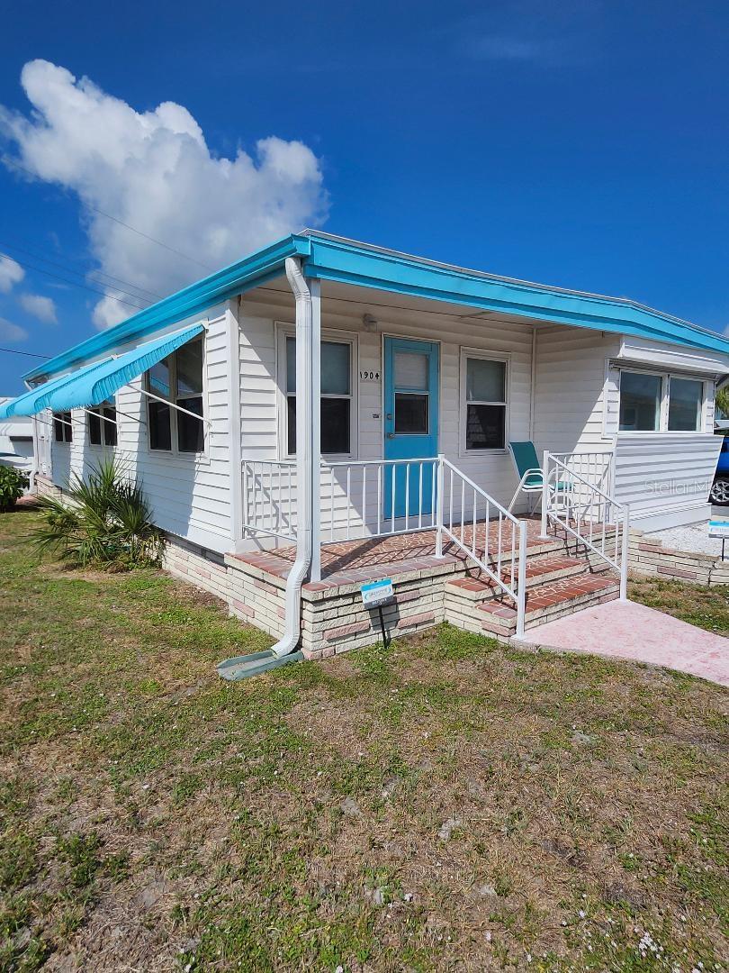 DON'T MISS THIS OPPORTUNITY FOR AN EXCEPTIONAL VALUE! Due to health reasons, Sellers have reduced the price $30k. TWO LOT PARCEL, ATTACHED GARAGE, FANTASTIC CORNER LOCATION! All the room you need. Good open floorplan, great square footage. Several updates to this three Bedroom, two Bath Mobile Home in the highly desired active 55+ Trailer Estates community. Large Master Bedroom with ensuite Bath easily fits a king size bed. Two covered porches, one front, one back to watch the world go by. Super oversized Carport; attached enclosed Garage is 14 X 25. New roof over main living area in 2024. AC new 2023. Located just up the street from the heart of the social scene, you won't have to drive anywhere to access the community pool, recreation buildings, shuffleboard, fitness center, and all the wonderful park amenities. You own the land. Boaters have direct access to Sarasota Bay from the Marina. Trailer Estates community offers so many options for a great day! Enjoy the large, heated community pool, hot tub, gym and wood shop. The community buzzes with pickleball, shuffleboard, kayaking, horseshoes, bocce, dancing and more. A US Post Office on site. 10 minutes to the SRQ Airport. Convenient to shopping, restaurants, the Arts and everything in Bradenton/Sarasota. Bring offers!