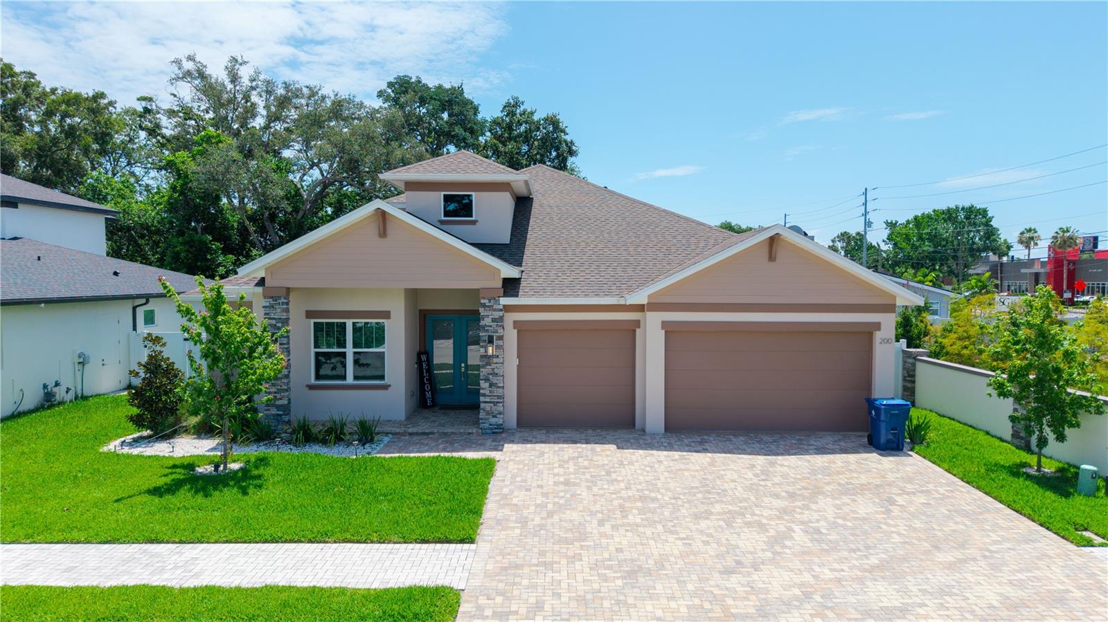 Welcome to Larocca estates! This GATED community features only 7 EXECUTIVE style homes located in the heart of Palm Harbor, FL. This 4 bedroom, 3 bathroom, 3-car garage/PAVERED driveway, plus an OFFICE, custom style home was RECENTLY built in 2023 and has numerous upgrades. This home boasts almost 2,600 sq ft, with an OPEN floorplan, STORM IMPACT WINDOWS, SPRAY FOAM insulation, volume ceilings, PLANTATION SHUTTERS, luxury laminate and tile throughout. The chefs kitchen is a great gathering space that overlooks the living room and features QUARTZ countertops, STAINLESS STEEL appliances, large custom PANTRY, all wood shaker cabinets, stunning backsplash, and huge center island. The primary bedroom is conveniently located on the first floor and features a huge walk-in DESIGNER closet and private en-suite. The OFFICE/NURSERY is located off the primary bedroom for convenience. Two other sizable bedrooms are conveniently located on the opposite side of the house, with a full bathroom in between, giving privacy to all. The second-floor bedroom/bonus room with an additional en-suite and large walk-in closet gives many options for sleeping and entertainment. Enjoy Florida living at its finest with an OUTDOOR kitchen/grill, extended back pavered patio with an aluminum roof and lanai, tropical landscaping with Areca palms and premium artificial turf professionally laid throughout the fully vinyl fenced backyard. This home is zoned for Palm Harbor schools, conveniently located near shopping, Gulf beaches, restaurants, and more. Schedule your private showing today!
