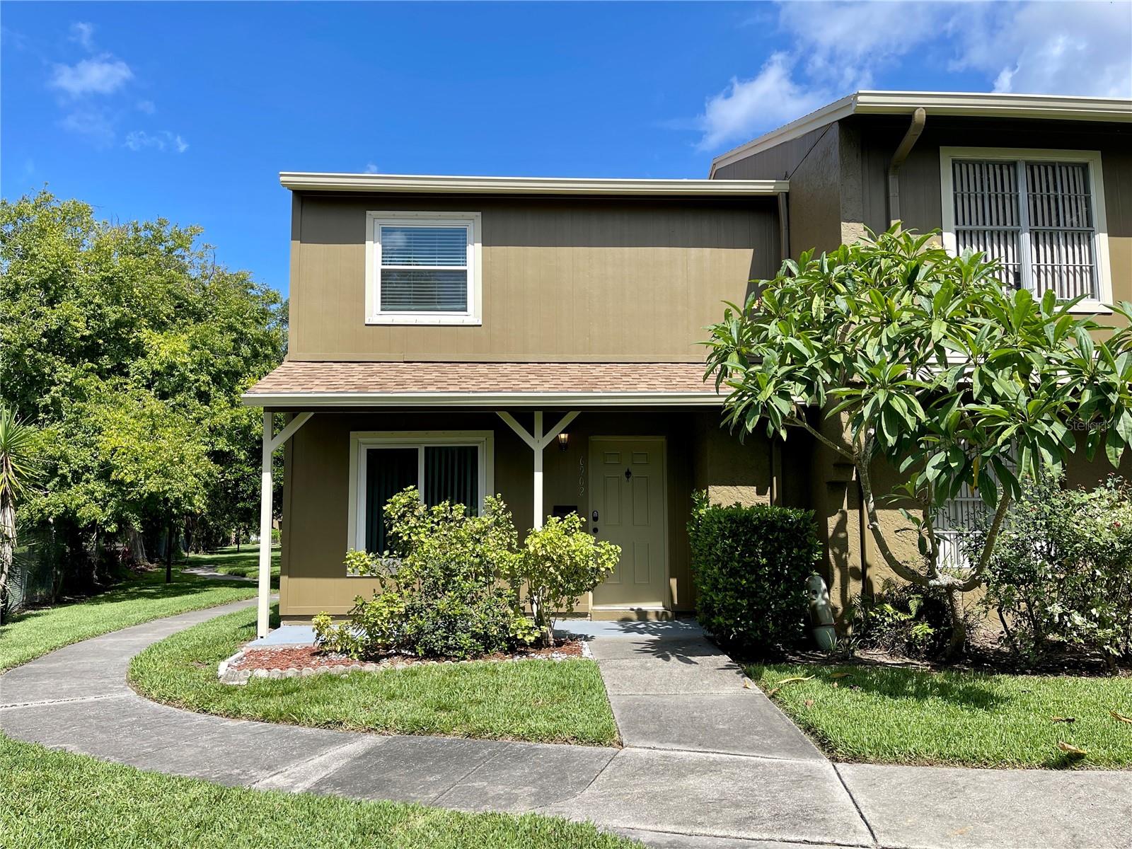 Delightful 2-Bedroom, 1.5-Bath End-Unit Townhome
Nestled in a beautifully landscaped setting with mature trees, colorful shrubs, and vibrant perennial gardens, this end-unit townhome offers comfort, privacy, and convenience. The fenced-in patio provides a peaceful outdoor retreat, ideal for relaxing or entertaining.
Inside, you'll find a spacious kitchen and dining room. The main level features tile flooring throughout, offering durability and easy maintenance. Upstairs includes two bright bedrooms and a modern, updated full bathroom. A washer and dryer are included for added convenience.
Enjoy two covered parking spaces just steps from your door, plus access to three community pools—perfect for swimming, exercising, or unwinding in the sun. Located close to the airport and Gulf Coast, this home combines tranquil living with unbeatable convenience.