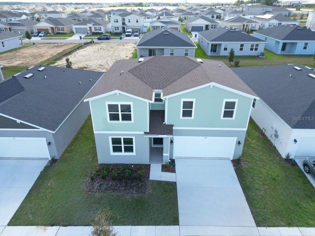 Photo of 1327 Normandy Dr, Haines City, FL 33844 (MLS # S5138631)