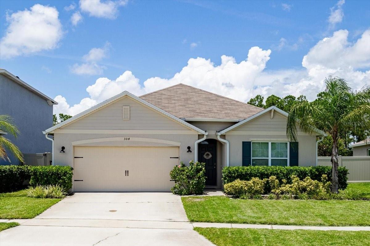 Welcome to this exceptional & beautifully updated Saltwater Pool Home with Modern Vinyl fenced yard. This 2021 built concrete block home is in the sought-after community of Woodbridge Lakes. This move-in-ready 4-bedroom, 2-bathroom residence combines thoughtful design, comfort, and premium upgrades—perfect for first-time buyers, families, or seasonal residents.
Step inside from the charming front porch into a bright foyer that leads to a spacious open-concept living and kitchen area, ideal for entertaining or relaxing with guests. The kitchen is a true centerpiece, featuring an island with seating, modern cabinetry, stainless steel appliances, a large pantry, and views that flow seamlessly into the dining and living spaces.
Enjoy the serene beauty of the outdoors from your covered lanai, with views of your tranquil pool setting that is beautifully landscaped. —The vinyl fenced yard surrounding the property makes for a private retreat. The salt water pool makes for an easy maintenance pool experience for any buyer. Whether cooling off in the summer sun, enjoying your morning coffee or watching a sunset, this backyard is a dream. Who wants to wait for their pool to be built when you can have one beautifully finished today!!
The home features a triple split-bedroom floor plan offering privacy for the spacious primary suite, which includes dual vanities, a step-in shower, a private water closet, a linen closet, and a large walk-in closet. Additional bedrooms are generously sized, providing flexible space for family, guests, a home office, or a gym.
Notable upgrades and features include:
• Luxury vinyl plank flooring throughout with tile in wet areas and carpet in bedrooms
• Smart home technology with ADT security system
• Energy-efficient construction
• Hurricane shutters included and full rain gutter system
• In-home laundry room with washer and dryer included
• 2-car garage with ample storage
• New professional landscaping and irrigation system using reclaimed water
• Dynamic Salt Water Pool and landscaped backyard Oasis
This home has never flooded and is not currently in a flood zone which makes flood insurance a choice and not a requirement. Convenience is key in this area as this home is nestled in newer neighborhood close to US-1, Whistle Stop Park, New Smyrna Beach, the Intracoastal Waterway, shopping, dining, schools, and local events—everything you need just minutes away.
Don’t miss this opportunity to own a beautifully upgraded home with a saltwater pool and fenced yard in a prime location. Schedule your private showing today!