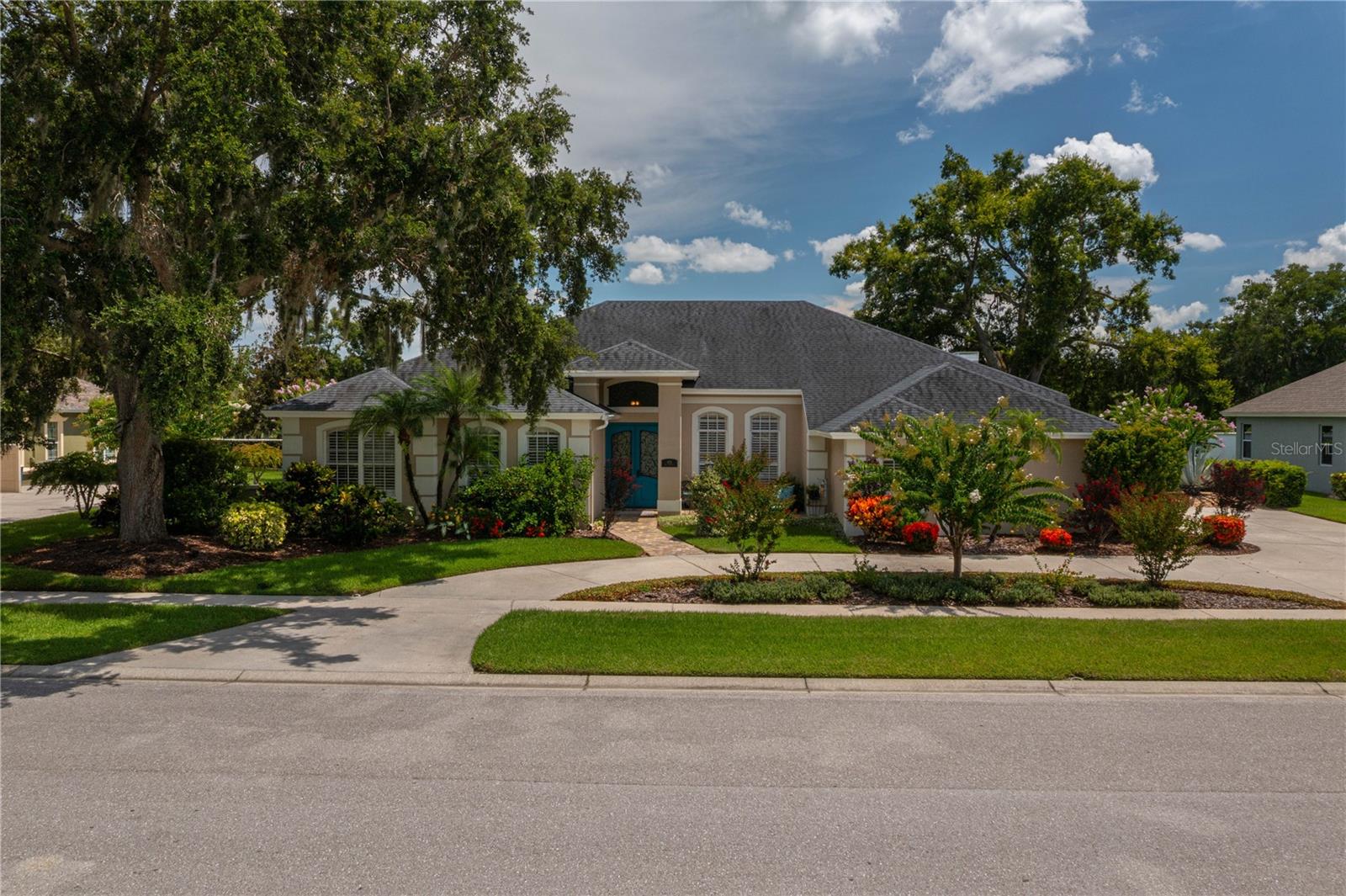 This gorgeous, meticulously maintained 4 BR/ 4 Bath (3 full, 1 half) home exudes quality with the perfect blend of functionality in gated Square Lake in Bartow. The lush landscaping, complete with irrigation, will wow you as you arrive and enter the 8' double entry doors. You will love the high ceilings, crown molding, exquisite chandeliers, plantation shutters, custom closets throughout, and split bedroom plan for added privacy for your family and guests. An open, but defined foyer, living room and dining room can be used formally or used to fit your family's needs, such as a home office. The stunning 14' x 17' kitchen is a completely open concept into an additional eating space and large 17' x 20' family room with a gas fireplace framed with lovely cabinetry. An abundance of cabinetry in the kitchen with granite countertops, under counter lighting, the convenience of pull out drawers, desk area, stainless appliances, center island with range with an eye catching range hood, and a breakfast bar your family and friends will love gathering around. A 6' x 11' butler's pantry with wet bar is a wonderful bonus for entertaining or food prep. A double door entrance to a large primary bedroom suite, with a spacious walk-in closet, a glamour bath with granite countertops, double vanities, massive mirror over vanity, garden tub, spacious shower, and a private water closet. The family and guest's favorite may be the fabulous large sparkling heated 12' x 28' pool (new in 2023) with a swim out and conveniently located pool bath. The spacious screened lanai lends to Florida's year-round indoor/outdoor living with glass sliders leading out to the pool with a built-in entertainment area featuring a wet bar with plenty of countertops for outdoor entertaining, as well as a built-in wine refrigerator and television visible from the pool and seating area--- perfect for fall football. Nice big laundry with sink, 3 car garage, circle drive and a fenced backyard. Centrally located with an easy drive to Lakeland and Winter Haven and approx. an hour drive to Orlando and Tampa airports.