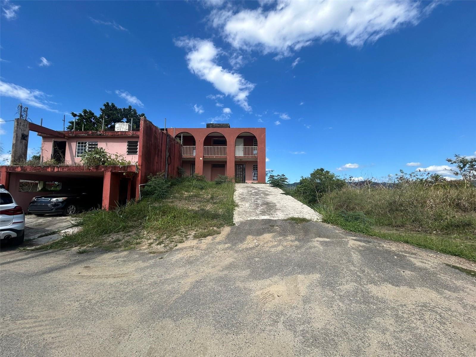One or more photo(s) has been virtually staged. For Sale: 4.392 Acres of Land with Property in the Exclusive Santa Bárbara Area, Gurabo
Price: $700,000
• Main Property: Two-story house in need of repairs.
• 4 bedrooms
• 3 ½ bathrooms
• Two terraces, perfect for entertaining or relaxing
• Two kitchens
• Basement with a space set up as an independent studio
Additional Details:
• The land includes 9 subdivided lots, each 900 m², ideal for residential development or investment.
• Features a road dividing the lots, complete with drainage infrastructure.