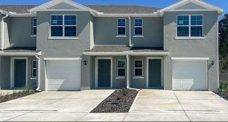 One or more photo(s) has been virtually staged. Come check out this Brand New Construction DR HORTON townhome located in the wonderful Vineyards neighborhood located in Holly Hill, FL. This home features 3 bedrooms, 2.5 bathrooms 2 story townhome with 1463 sq ft living space. First floor has living, dining, kitchen with all new stainless steel appliances, and the home also has smart home thermostat and lights with security system. Ring doorbell camera. Tile throughout bottom floor for easy maintenance. Upstairs features 3 bedrooms. Carpet throughout. Lots of room. Water view. Priced accordingly, this home won't last long.