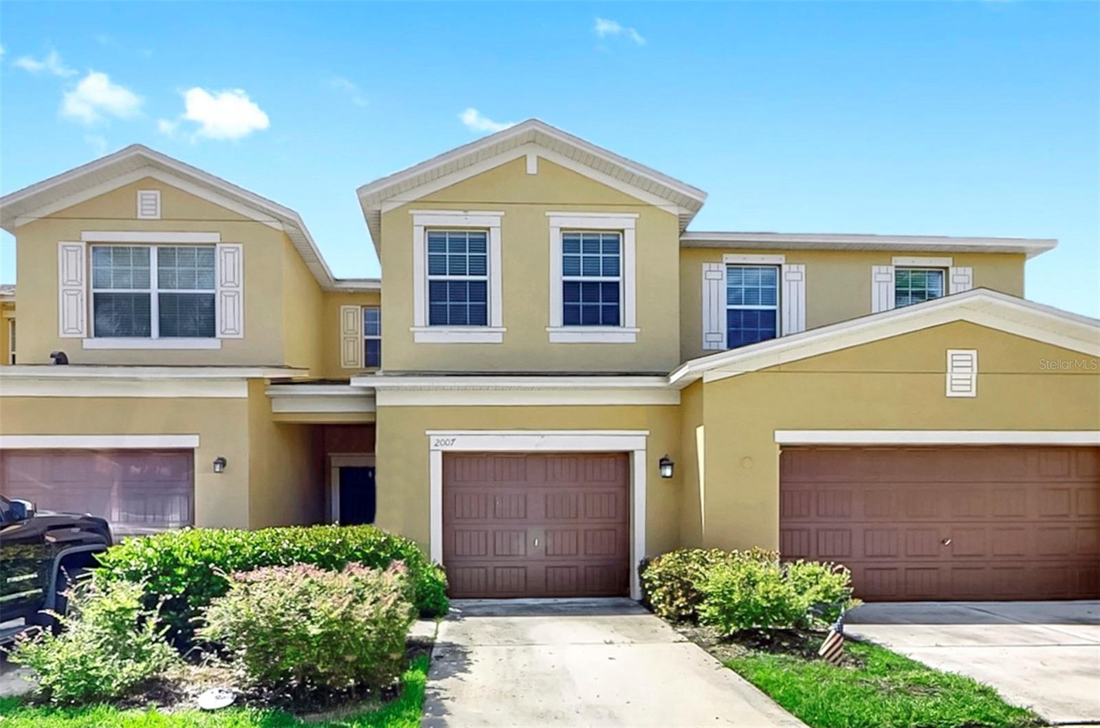 One or more photo(s) has been virtually staged. Welcome to this spacious three-bedroom townhome in the desirable gated community of Hawks Point, offering abundant storage, stylish finishes, and the perfect blend of comfort and convenience. The easy-care tiled first floor boasts an open layout that seamlessly connects the living and dining areas to sliding doors and your screened lanai with peaceful pond views, ideal for enjoying the Florida sunshine. The beautifully appointed kitchen features granite countertops, stainless steel appliances, a breakfast bar, a huge pantry with bonus storage under the stairs, and a walk-in storage closet off the living room, plus a convenient half bath. Upstairs, brand-new carpet leads you to a versatile loft space, laundry room, and three bedrooms, including a primary suite with a walk-in closet and ensuite bath with dual sinks, while the other two bedrooms share a full bathroom. BRAND NEW ROOF 2025. Residents of Hawks Point enjoy resort-style amenities including a clubhouse, sparkling pools, a fitness center, playgrounds, and a dog park. With quick access to I-75, US-301, and US-41, you're just minutes from MacDill AFB, USF, downtown Tampa, Brandon, Sarasota, and Gulf Coast beaches, plus shopping, dining, a mall, and movie theaters are right around the corner, everything you need for the perfect Florida lifestyle!