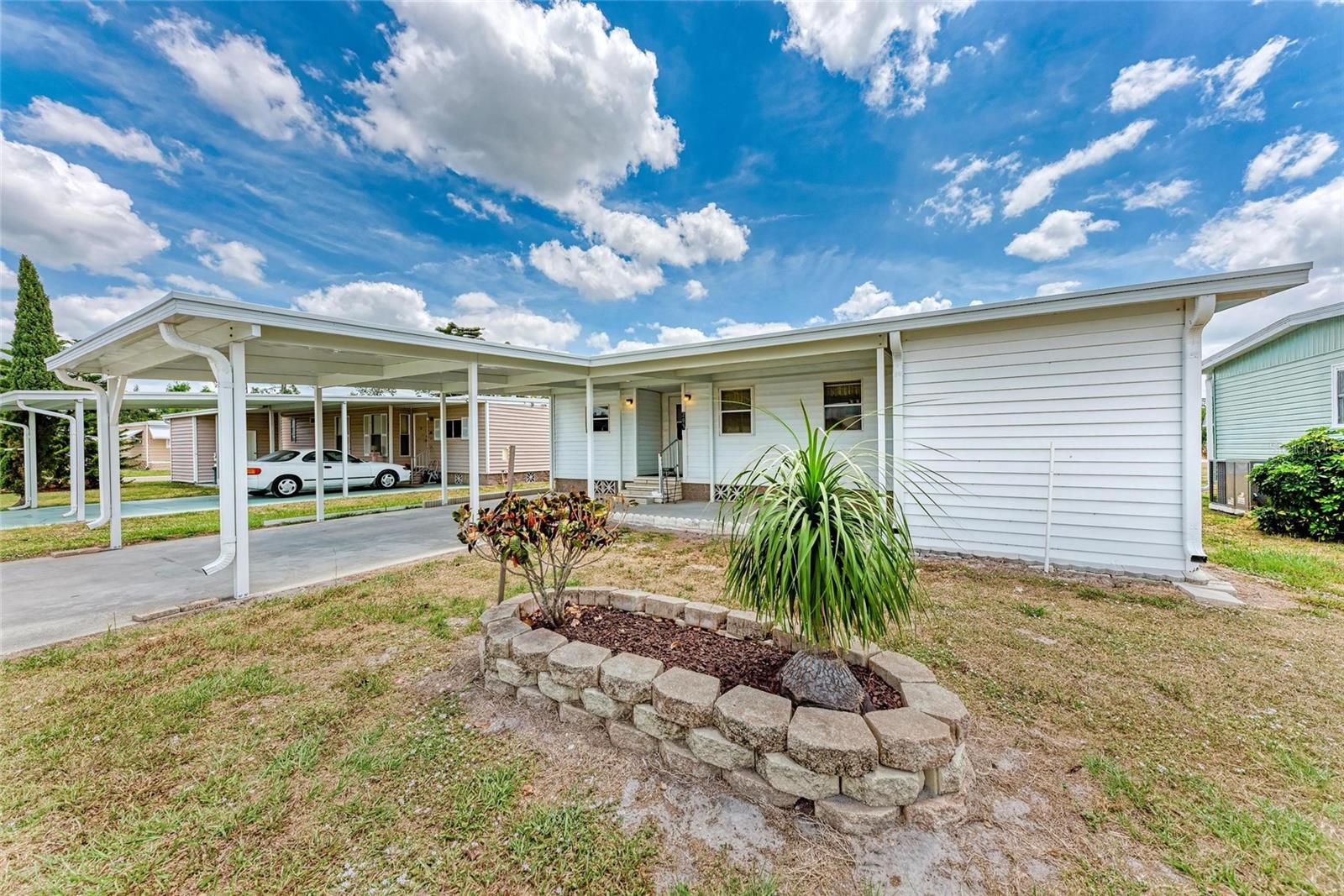 Welcome to this well-maintained 2 bedroom, 2 bathroom double-wide mobile home located in the highly sought-after 55+ community of Terra Ceia Manor—where the land is owned, not rented! Conveniently situated right next to the community center, this home features a brand-new CARPORT and ROOF , spacious layout, and a bright sunroom perfect for relaxing or entertaining. Terra Ceia offers an unbeatable Florida lifestyle with amenities like shuffleboard, a swimming pool, and a clubhouse that’s always buzzing with activities—from potlucks to games and social events. Don’t miss your chance to live in this vibrant and welcoming community!