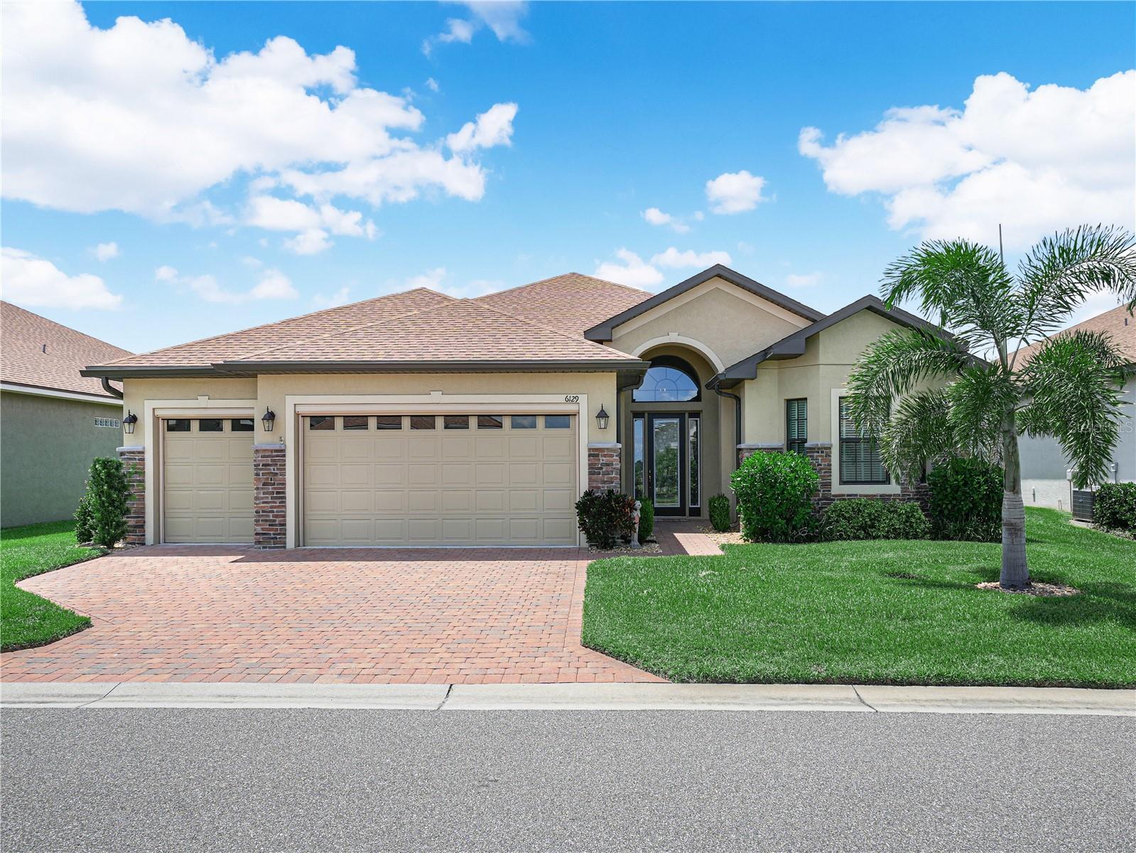 Live the Florida Retirement Lifestyle You've Been Dreaming Of In Lake Ashton. Built in 2022, this 3 Bedroom / 2 Bath home with tile flooring throughout is located behind the gates of Lake Ashton, a 55+ community with resort style amenities. 6129 Pebble Beach Blvd. Winter Haven, Florida is a SEBASTIAN FLOOR Plan with over 2,000 sq. ft. living space. This home has excellent curb appeal with stone on the exterior of the home, separate golf cart entry, paver driveway, automatic screen on the 2 car garage door and golf cart garage entry, and well maintained lawn. When you step thru the glass front door of this home you have an unobstructed view of the pond located in the back of the home. To the right of the front door is the guest living area. A pocket door provides privacy to the Bedroom 1 and Bedroom 2, as well as the Guest Bath. A linen closet is in the hallway that separates bedroom 1 and bedroom 2. Bedroom 2 has shelving for books, art collection/books and could be used as an Office or Craft Room. To the left of the front door is the formal dining area and the kitchen. The open/spacious living room with trey ceiling is directly in front of you with triple sliders that lead to the covered and screened lanai. The Primary Suite is located on the rear of the home. The Kitchen has a breakfast bar, Stainless Steel Appliances, stone counter top, tiled backsplash, 42" cabinets and a separate dinette area with window overlooking the screened lanai. The Range in the kitchen is not electric; it operates off of propane gas (the buried tank is owned; The size is 250 Gallon.) The washer/dryer are located in the laundry room, which is located between the garage and kitchen. There is plumbing in the laundry room to add a wash sink. The Primary Suite has a large walk in closet, separate water closet, His and Her Separate comfort height Vanities and Large Walk In Shower with glass block above. Additional items in the home that use the Propane Gas: Tankless Hot Water Heater and Connection for a Gas Grill. You'll enjoy the outdoor living space in this home, too. Grab a book, pour a glass of wine, or fire up the grill and relax on the covered and screened lanai with extended birdcage. Tour this home today! Lake Ashton offers a large Clubhouse with Restaurant (Charm City), Movie Theater, Bowling Lanes, Card, Craft, Billiards, Media Center, Fitness Center, Outdoor Heated Pool, Bocce Courts, Tennis Courts, Shuffleboard Courts. There is also a Health and Fitness Center in Lake Ashton. The HFC has a large indoor pool, Pickleball Courts, Tennis Courts, Card, Craft, Billiards and Fitness Center and MORE!!!! Lake Ashton is conveniently located to shopping, medical facilities and entertainment. Come enjoy the Florida Retirement Lifestyle in Lake Ashton.