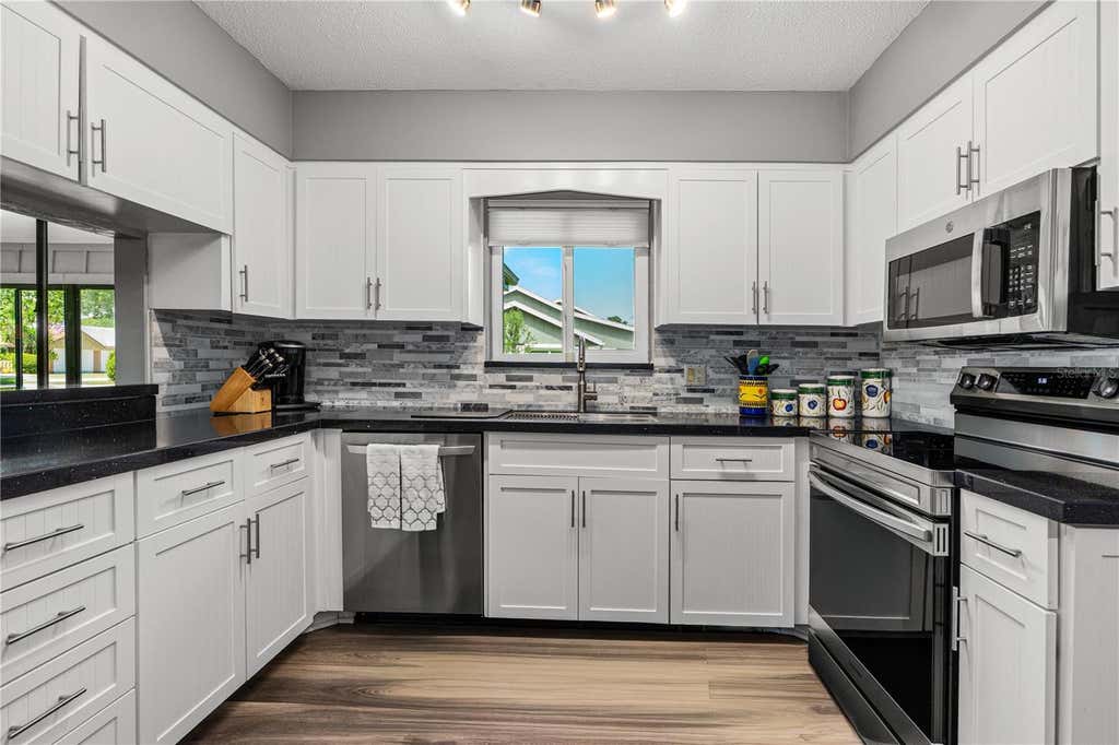 Photo of 34 Lake Fairgreen Circle, New Smyrna Beach, FL 32168 (MLS # FC319779)