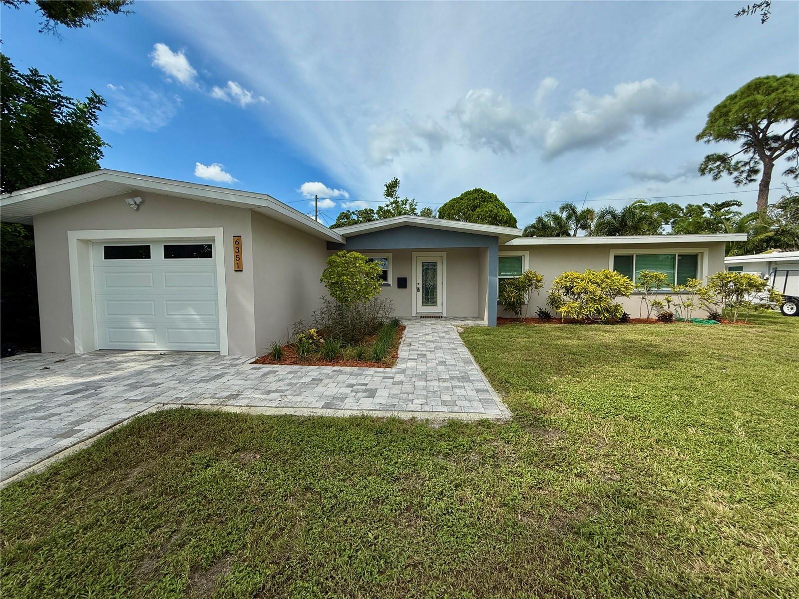Welcome to this fully renovated 4-bed, 2-bath home nestled in a peaceful and friendly neighborhood. From the moment you walk in, you’ll love the natural light, open layout, and thoughtfully selected finishes throughout.
The heart of the home is the stunning kitchen, featuring a large peninsula perfect for meal prep or casual seating. The spacious great room offers plenty of room to relax or entertain, while the private master bedroom includes its own mini-split A/C for personalized comfort.
Enjoy the convenience of a 1-car garage, interior laundry room, and a lovely backyard patio—ideal for outdoor gatherings or quiet evenings at home. Recent upgrades include a new roof, A/C, electrical panel, and water heater, plus hurricane impact windows for added peace of mind. Best of all, this home is located in a non-flood zone with easy access to everything you need.
This one checks all the boxes—style, comfort, and a great location!