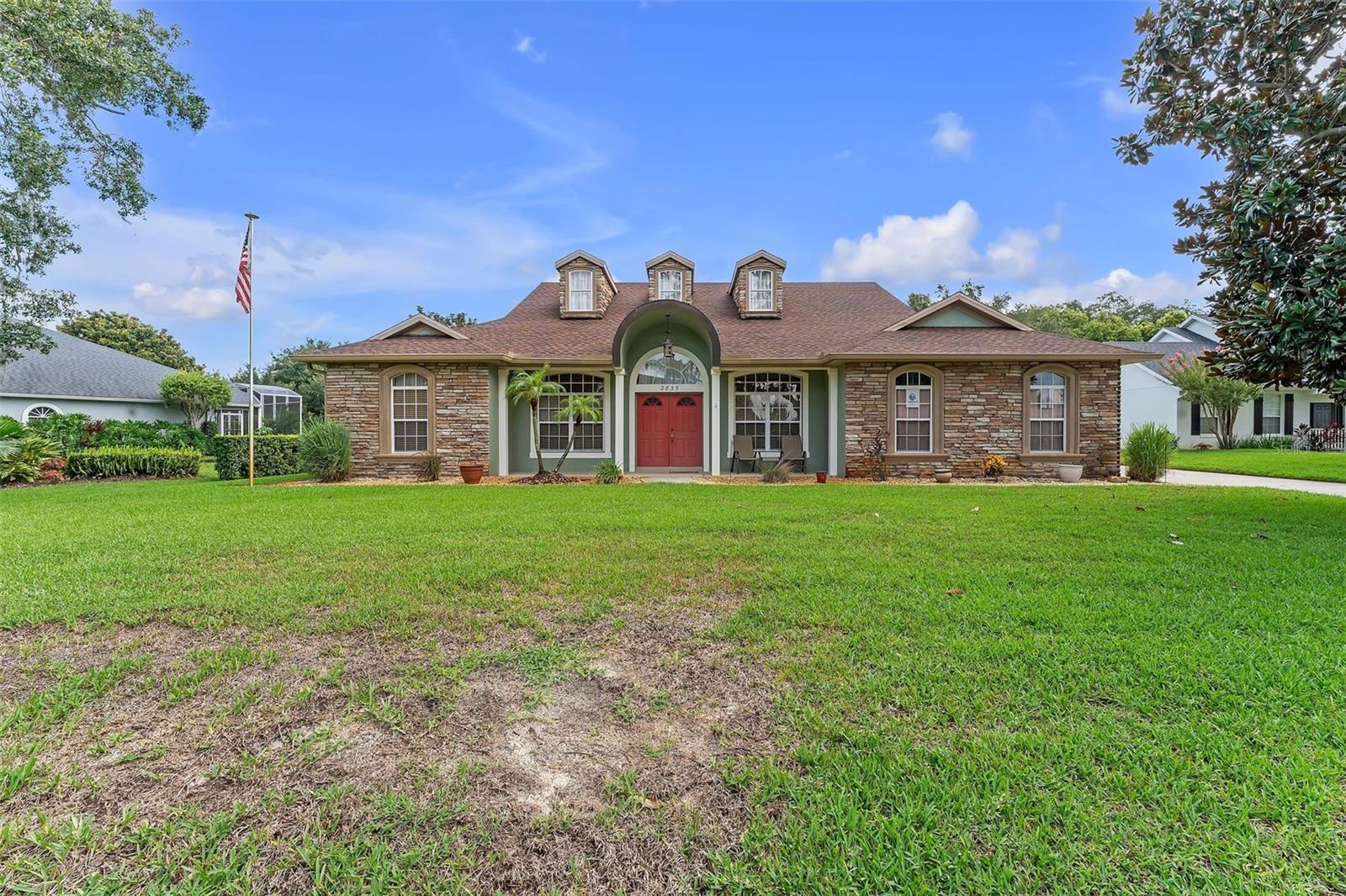 This brick home offers 3 bedrooms/2 bathrooms, with a total of 2,178 sq. ft. of living space. The property sits on a large 0.3 acre lot. The kitchen features wooden cabinets, granite countertops, floor tiles, and a breakfast counter. The dining room features tile flooring. The room across from the dining area has been converted into a home office and bedroom with carpet flooring. The remaining two bedrooms are also carpeted and include walk-in closets. The bathrooms are equipped with wooden cabinets and tiled floors, and a dedicated laundry area.
A sunroom at the back provides a quiet space for relaxation. The roof is 1 years old, and the A/C unit is only 2 years old. Outside, the property includes a wide backyard with a well-kept lawn and a small storage house. The property also features a 2-car garage.