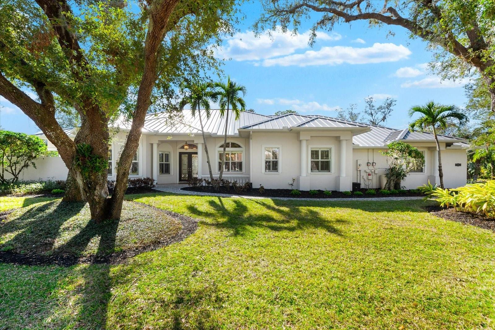 This stunning 4 Bedroom, 4.5 bath meticulously crafted 2002 residence has been updated and modernized with Smart Home technology including Control 4, Sonos, Lutron, Tesla, ClareVision, Pentair, and MyQ. Experience unparallelled convenience by controlling nearly every aspect of your living environment from anywhere—whether you're cozied up on the couch, on the way home, or away on vacation. A new metal roof and solar panels (PV) with Tesla inverters installed in March 2024 are the ultimate energy saver and have dramatically slashed electricity bills by over 80%. The inviting family room complete with gas fireplace, large screen TV and an immersive Klipsch surround sound system is perfect for movie nights and gatherings. Challenge friends in the game room equipped with a TV, pool table and dartboard, or retreat to the elegantly appointed office featuring built-ins and a serene reading tower. The gourmet kitchen is a chef's delight, showcasing a Wolf 6-burner cooktop, stainless steel appliances, endless granite countertops, cherry cabinetry, and a large walk-in pantry. Enjoy the tranquility of the secluded screened outdoor area with gas fireplace and a soothing fountain. The spotless 3-car garage comes with a new epoxy floor, a dedicated workbench area, and an additional refrigerator for your convenience. The home opens seamlessly to the sprawling lanai, where you'll find multiple seating and entertaining areas and an incredible heated pool with spillover spa, all basking in prime southern sun. Situated on a serene .95-acre wooded lot offering complete privacy with deer wandering through your backyard and birds and wildlife abound. Laurel Oak Estates is a 24/7 guard gated community with 405 homes spread over an expansive 813 acres, with 8+ miles of walking and biking paths. Laurel Oak Country Club is one of Sarasota’s premier member-owned golf clubs with 36 holes of golf, tennis, pickleball, aquatics and endless social activities. Active men’s and women’s golf leagues as well as daily drop-in games for all handicap levels. The staff and membership are super friendly and new members are openly welcomed. IMMEDIATE GOLF - Golf enthusiasts looking to join Laurel Oak Country Club jump straight to the top of their waitlist at closing!