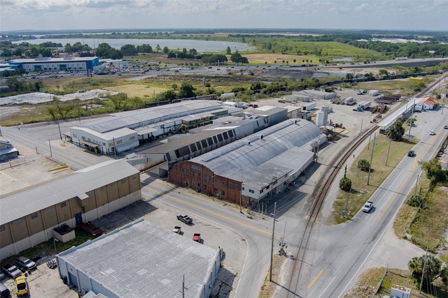 Two Industrial Buildings in Central Florida – Over 104,000 Square Feet on 5.23+ Acres, Zoned Heavy Industrial.  A rare opportunity in Central Florida’s Booming Industrial Market!
A rare opportunity in Central Florida’s Booming Industrial Market! This is an opportunity to own or invest in a centrally located, power-ready, high-utility industrial property in Polk County — one of the most strategic industrial corridors in the Southeastern U.S.
Located just minutes from I-4 and one block off US-17, this property sits squarely between Orlando and Tampa, offering unmatched access and long-term potential across a wide range of industrial, commercial, and trade applications.
And just announced: A brand-new Super Target is coming in 2026, located immediately east of this site along US-17 — placing your investment at the heart of Winter Haven’s next major retail and traffic hub. This kind of high-profile development is a strong signal of continued growth, demand, and infrastructure investment in the area.
Whether you’re a contractor, investor, logistics operator, or manufacturer — this is a rare opportunity to secure your footprint in the path of progress.
Building A – 650 Avenue R SW
Total Size: 54,882 SF
Functional SF: 42,830 SF
Year Built: 1947 (with additions)
Construction: Steel frame, metal siding, block and concrete sections
Key Features:

    3-phase, 480V, 1600 AMP service
    Primarily warehouse use with 91% usable industrial space
    Ground-level drive-in access with 12' x 14' door
    Multiple warehouse sections with 20’–31’ clear heights
    Former cooler and cold storage areas
    Second floor office space (4,800+ SF) with renovation potential
    Dock-high loading platform with 4 truck positions
    Rough buildout provides flexibility for demo or rehab
    Yard access & open storage areas to the south and west
    Fire sprinkler system installed

? Ideal for: Logistics hub, manufacturing plant, contractor HQ, warehouse operation
Building B – 500 Avenue R SW
Total Size: 53,839 SF
Functional SF: 37,386 SF
Year Built: 1926 (with later additions)
Construction: Wood frame, metal, vinyl and concrete block
Key Features:

    3-phase, 480V, 800 AMP electrical
    Rail Spur on Property
    Mix of concrete and wood floor systems
    Dock-high loading with 4 doors on northeast side
    Cooler areas and warehouse zones with up to 20’ clear heights
    Office/cafeteria space on first floor
    Second floor mezzanine offices in functional condition
    Warehouse/storage areas with grade-level access
    16,000+ SF of flexible, limited-function areas for reconfiguration
    Sprinkler system in place

? Ideal for: Cold storage retrofit, ag-processing, distribution center, recycling or materials handling operation
Site & Zoning Details 

    Total Land Area: 5.23 Acres
    Zoning: I-2 Heavy Industrial
    Utilities: Municipal water/sewer, electric, gas
    Yard: Ample outdoor space for equipment storage, trailers, or future improvements
    Access: Via Avenue R SW, between 3rd St. SW and 7th St. SW
    Optional Division: Each building can be sold or operated independently, with potential for separate site access

Whether you’re a contractor needing a new headquarters, a manufacturer ready to expand, an investor looking for upside, or a logistics operator seeking strategic positioning in Central Florida — this is your moment.