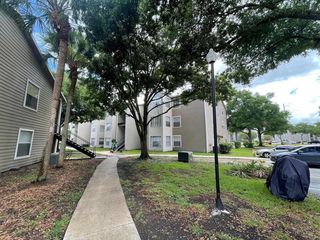Photo of 4708 Walden Circle #1812, Orlando, FL 32811 (MLS # O6430746)