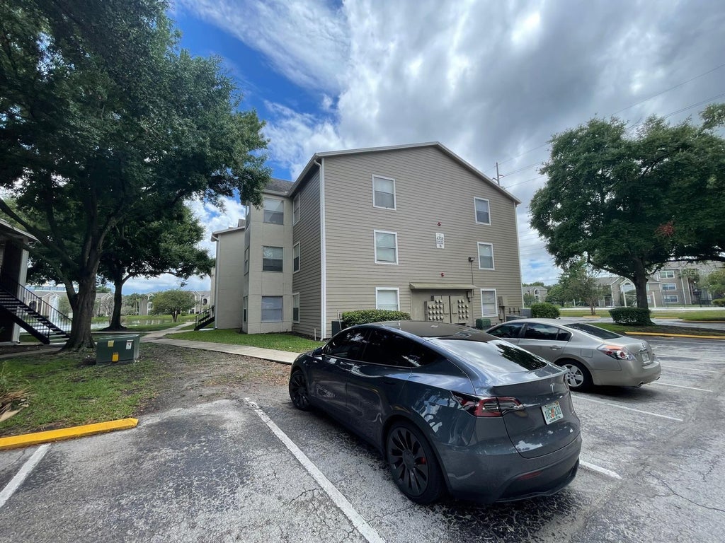 Photo of 4708 Walden Circle #1812, Orlando, FL 32811 (MLS # O6430746)