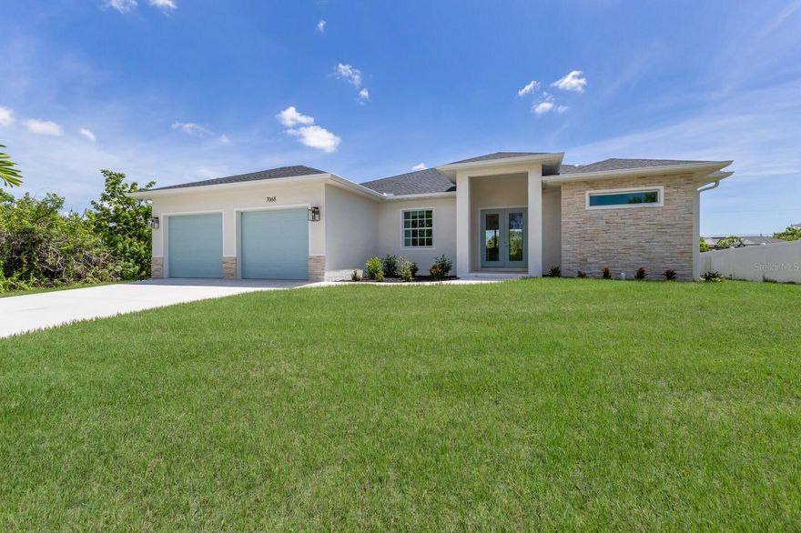 This BRAND-NEW home exudes quality craftsmanship—unmistakable from the moment you arrive! The coach-lit driveway, stone-accented exterior, welcoming front porch, and elegant double-door entryway set the stage for the beauty found within. Located in the highly desirable beach community of Englewood, this 3-BEDROOM + OFFICE, 2-BATHROOM, 2.5-CAR GARAGE home was built with no detail overlooked and no feature understated!

Inside, you’ll find soaring volume ceilings and 8-foot doors throughout. The Living Room features an impressive tray ceiling with recessed lighting, crown molding, a 6-foot ceiling fan, and a 3-panel sliding glass door that opens to the covered lanai—creating a bright, sunlit sanctuary.  The separate Dining Area, enhanced by two sets of sliding glass doors, offers ample space for entertaining and your favorite sideboard.  At the heart of this open, convenience-driven floorplan is the chef-inspired Kitchen—complete with an incredible 9-FOOT ISLAND, TWO 5-FOOT PANTRIES, high-end stainless steel appliances, TILE BACKSPLASH, and solid wood, SOFT-CLOSE cabinetry topped with luxurious veined QUARTZ countertops. Brushed nickel hardware and thoughtful finishes make this the hub of the home and the centerpiece for gatherings.

The split floorplan provides owner privacy, with the Primary Suite offering direct lanai access, a tray ceiling, transom window for natural light and privacy, two walk-in closets, and a luxurious en suite bathroom featuring an enormous walk-in tiled shower with DUAL SHOWERHEADS, split vanities with QUARTZ countertops, a private water closet, and a linen closet.

Throughout the home, you’ll find a premium lighting package including ceiling fans with lights, pendant fixtures over the island, and elegant chandeliers in the foyer and dining room. Easy-care, allergen-free porcelain plank flooring runs throughout.  Showcasing one of Interior Designers’ top picks for 2025, the home includes stylish shiplap accents on the kitchen island, Living Room wall, and foyer feature wall.

For peace of mind, this home is equipped with HURRICANE IMPACT WINDOWS AND SLIDING GLASS DOORS—offering security and confidence even when you’re away.

Step outside to enjoy TWO LANAIS—one an impressive 30 feet long, perfect for entertaining, and the other a private retreat adjoining the rear guest bedroom.  The oversized 25’x22’, 579 sq. ft. 2.5-car garage features two 10-foot hurricane-rated overhead doors (instead of one standard 16-foot), providing extra parking and maneuvering space, plus a convenient side-yard exterior door.

With NO HOA and NO DEED RESTRICTIONS, this property offers exceptional flexibility—live here year-round, rent it seasonally, or Airbnb it. NO flood insurance required.

Built by a local Floridian builder who understands what’s needed for longevity and durability in Southwest Florida, this home features a HIP ROOF design for long-term insurance discounts, OFF-RIDGE roof venting, and STEM WALL construction, which far exceeds monolithic slabs for storm resilience.

Ideally located near golfing communities, marinas, boat launches, and Englewood’s beautiful beaches, this nearly 2,100 sq. ft. home feels even larger thanks to its open layout and soaring ceilings.

POOL PACKAGES START AT $60,000.

This gem is priced to sell and waiting for you—call today for your private tour!