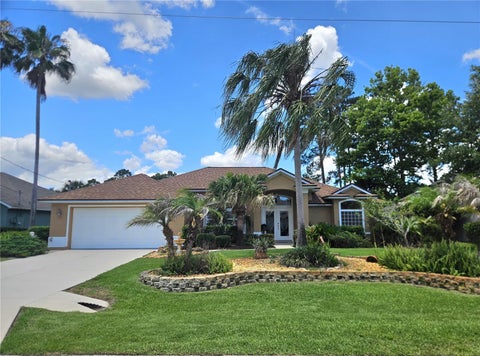 Photo of 79 Brownstone Lane, Palm Coast, FL 32137 (MLS # FC318964)