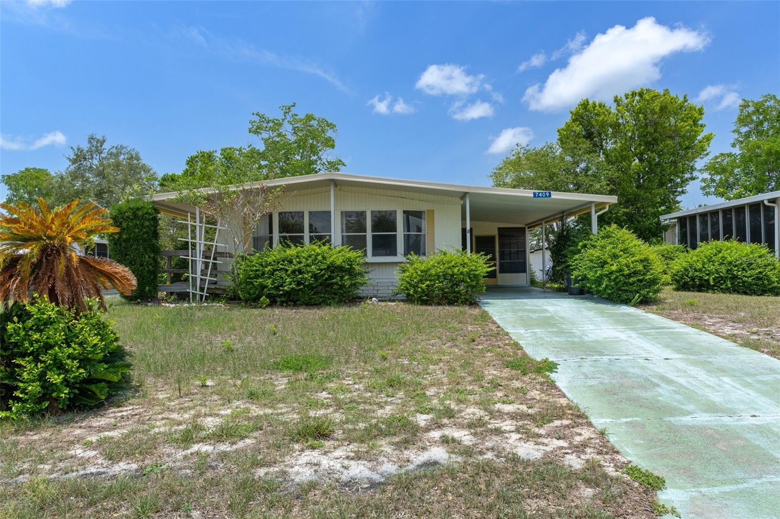Offering over 1,200 square feet of living space, this home features an open floorplan perfect for comfortable living and entertaining. Enjoy the generously sized family room, a spacious kitchen, and two large bedrooms with plenty of storage. Step outside to relax on the screened porch or patio. While the home needs some TLC, it’s a fantastic opportunity to make it your own. Located in the sought-after Highpoint 55+ Golf Community with low HOA fees, community pool, social clubs, golf, and so much more. Best of all...You own the land.