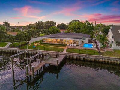 Welcome to 1124 35th Avenue Northeast in St. Petersburg, FL. This modern and casually elegant property offers an unparalleled waterfront
lifestyle with 82 feet of water frontage on Smack's Bayou. This renovated ranch-style home features a split floor plan and boasts 3 bedrooms and 2 bathrooms, plus an office, dining space, formal living, family room, and an oversized sun room adding just over 560 sf of living space.
Additional upgrades include, a fully remodeled primary bed and bath in 2022, a new roof (2024), all new plumbing (2021), and an HVAC system replaced in 2023. The home also features luxury vinyl flooring throughout as well as propane gas used for the inside range and tankless water heater, two car garage with laundry and extra storage, plus a circular drive. In addition to the Florida room, outside you will find a swimming pool, completely fenced in yard, boat dock (2010), 13k lb boat lift (2020), newer concrete seawall, brick paver patio, views of Smack's Bayou, and unobstructed boating access to Tampa Bay. With a total square footage of 1,965 and a generous lot size of 9,679 square feet, or just under a quarter acre, this property also presents an opportunity to build your own custom waterfront home. Located in Old NE Park Shores on a private cul-de-sac, you are less than 4 miles to the St. Pete Pier and all that downtown St. Pete has to offer. Home experienced limited flooding during Helene to the garage and sun room, both have been remediated. No damage from hurricane Milton. Available immediately.