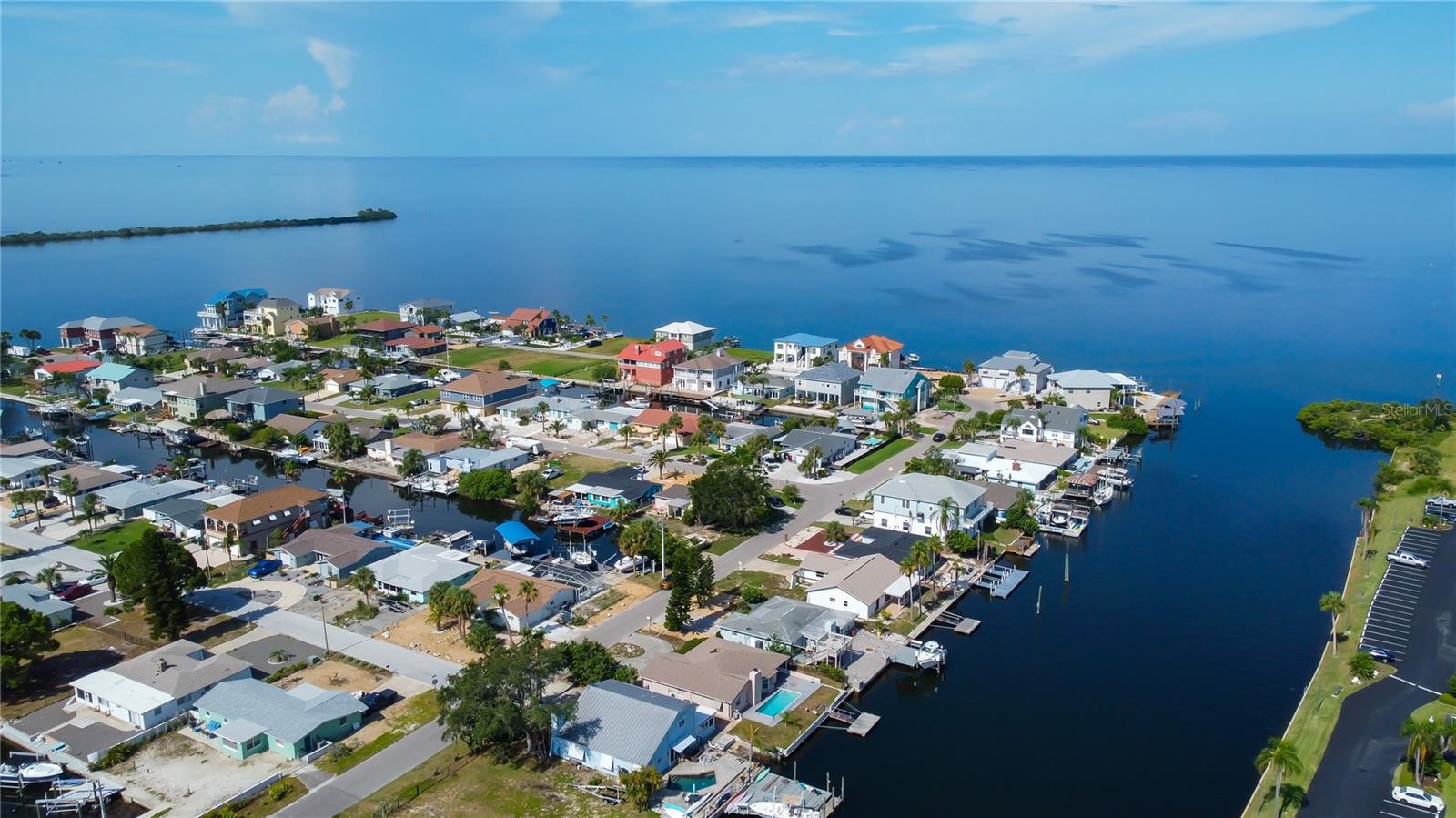 IF YOU ARE A MARINER, YOU WANT THIS LOT! DEEP, WIDE CANAL AND ACCESS TO THE GULF IN SECONDS! BE A PART OF THE SEA RANCH COMMUNITY! GOLF CART FRIENDLY, GREAT COMMUNITY CLUBHOUSE. SELLER FINANCING AVAILABLE WITH A MINIMUM OF 20% DOWN. Are you ready to see DOLPHINS AND MANATEES IN YOUR BACKYARD WHILE YOU ENJOY A SWIM IN THE POOL? How about SPECTACULAR SUNSETS? Do you want to live in a community with NO HOA? How about the ability to KEEP YOUR BOAT, JET SKI AND WATER TOYS ON YOUR OWN PROPERTY? This fabulous floorpan is spacious and also can CONVERT TO A 3 BEDROOM HOME EASILY. You can make the interior however you'd like, you can't change this desirable and stunning waterfront lot. NEWER ROOF, AC, AND POOL PUMP.