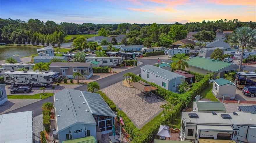 Your piece of Florida paradise awaits in the highly sought-after community of Elite Resorts at Citrus Valley. Lot #207 boasts extended pavers, lush landscaping with full lot hedge fence, hardwired lighting, an irrigation system. Additionally, this lot includes a beautiful, over-sized , anchored patio gazebo for shade to enjoy the outside.  This meticulously maintained, high-quality resort is conveniently located approximately 15 miles from Disney and 13 miles from the charming downtown Clermont, known for its weekly farmers markets, food truck events, and more. The quarterly condo fee of $704 covers lawn maintenance, cable, WiFi, sewer, water, and trash removal. The only additional cost is your electricity bill, making this lot ready for immediate move-in. The resort features a large clubhouse, a spacious pool, two bathhouses, laundry facilities, and a variety of social events and entertainment. Whether you choose to make this your winter retreat or year-round residence, the property offers short-term rental opportunities, allowing you to use it part-time and rent it out the rest of the time, or enjoy it full-time yourself. Schedule your showing today and experience the best of Florida living.