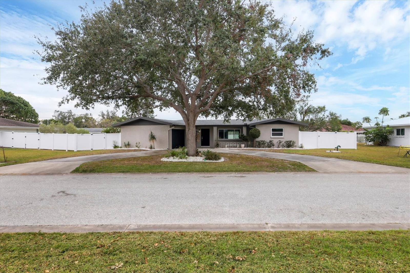 Price Reduced 06/26/2025 for quick sale : ROOF REPLACED IN 2024, IMPACT WINDOWS AND DOORS IN 2024, A/C NEW IN 2025, NEW ELECTRICAL SERVICE AND PANEL IN 2024, ALL NEW PLUMBING AND DRAIN LINES 2025. NO DAMAGE FROM HURRICANE HELENE OR MILTON! NO HOA, UNDER 3 MILES TO DOWNTOWN SARASOTA, AND LESS THAN 1 MILE FROM SARASOTA MEMORIAL HOSPITAL, THIS HOME IS IN A DESIRABLE AREA WITH A GREAT LOCATION TO DINING AND FUN! UNDERGROUND POWER AS OF 2025, A HUGE UPGRADE FOR THIS HOME! 2025 HOT WATER TANK.
NEW BATHROOMS, A NEW MASTER SUITE WITH WALK IN CLOSET AND PRIVATE BATH! SPLIT FLOOR PLAN WITH MASTER ON ONE SIDE, AND 2 BEDROOMS ON THE OTHER SIDE WITH A GUEST BATH. LARGE OPEN FLOOR PLAN WITH SEPERATE AREAS FOR DINING TABLE AND LIVING ROOM. A NEW AND IMPROVED OPEN STYLE KITCHEN WITH SEATING AT THE ISLAND AND STAINLESS STEEL APPLIANCES. THIS HOME HAS A SPACIOUS BACK YARD THAT IS COMPLETELY FENCED IN WITH A 6' PRIVACY FENCE WITH 2 ENTRANCE GATES. A LARGE CIRCLE DRIVEWAY OFFERS PLENTY OF PARKING, AS WELL AS AN OVERSIZED ATTACHED 1 CAR GARAGE.
MOVE IN READY