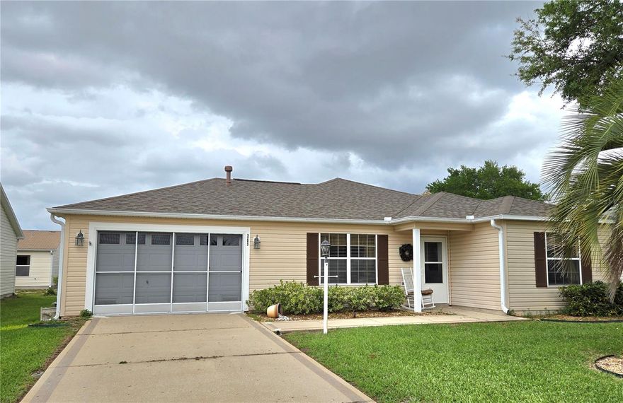 Welcome to The Villages in the Village of Summerhill! This TURNKEY Austin model offers 2 bedrooms, 2 baths, immediate occupancy, and even includes the golf cart and furnishings for an easy move-in experience. Ideally located near CR 466, you are just a 5-minute golf cart ride to shopping, restaurants, and everyday conveniences. Inside, the home features crown molding, vaulted ceilings, no carpet, and a spacious enclosed 12x20 lanai with air conditioning, creating great additional living space to enjoy year-round. The kitchen offers a breakfast bar and opens to the dining area for easy entertaining. The primary suite includes a large walk-in closet, and the home is equipped with natural gas range, heat, water heater, and dryer. Conveniently situated between Spanish Springs Town Square and Lake Sumter Landing Town Square, this property is also close to recreation, the Polo Fields, and the neighborhood pool. Roof updated in 2022. Come enjoy The Villages lifestyle!